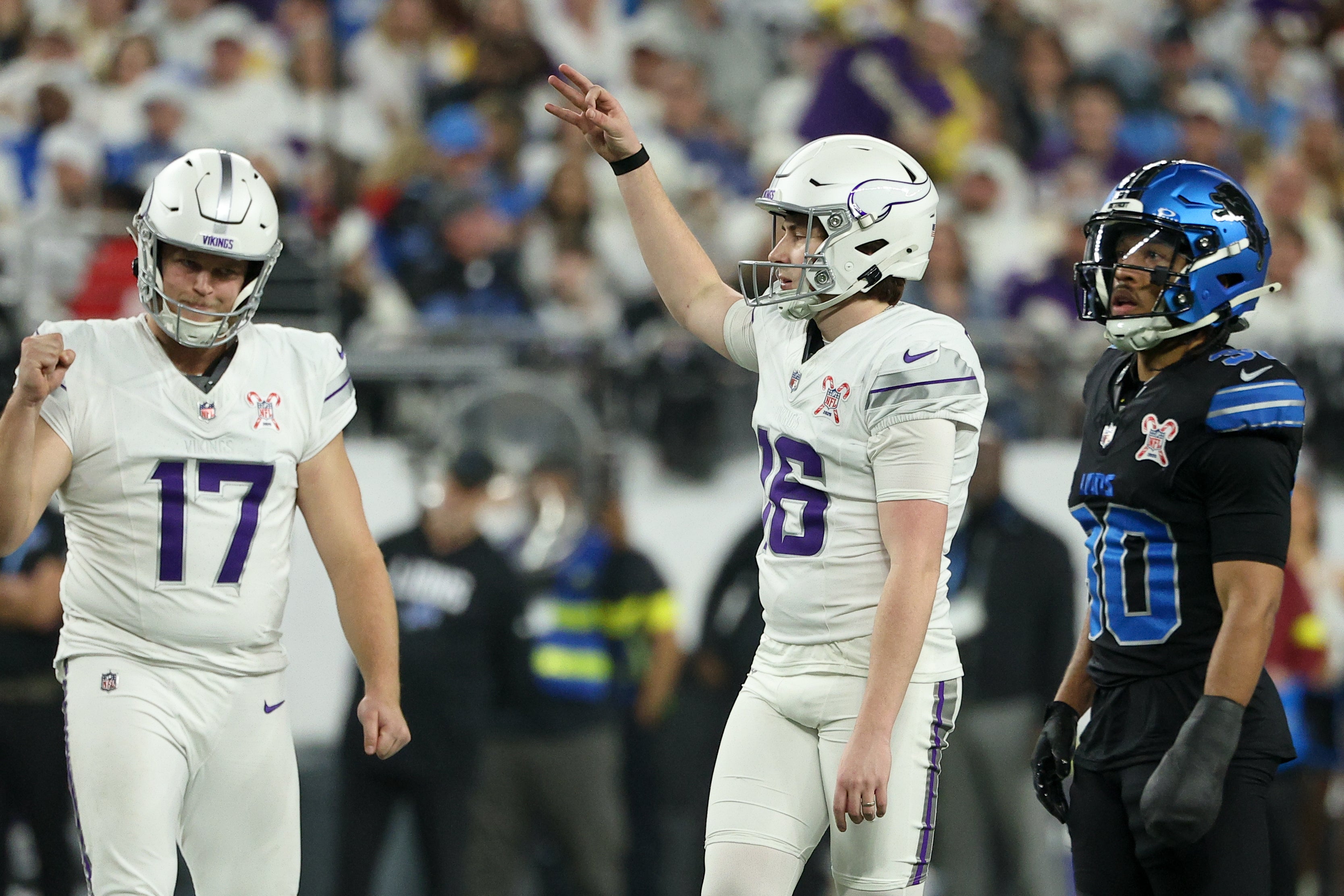 Dec 25, 2025; Minneapolis, Minnesota, USA; Minnesota Vikings place kicker Will Reichard (16) celebrates after making a field goal against the Detroit Lions in the third quarter at U.S. Bank Stadium.