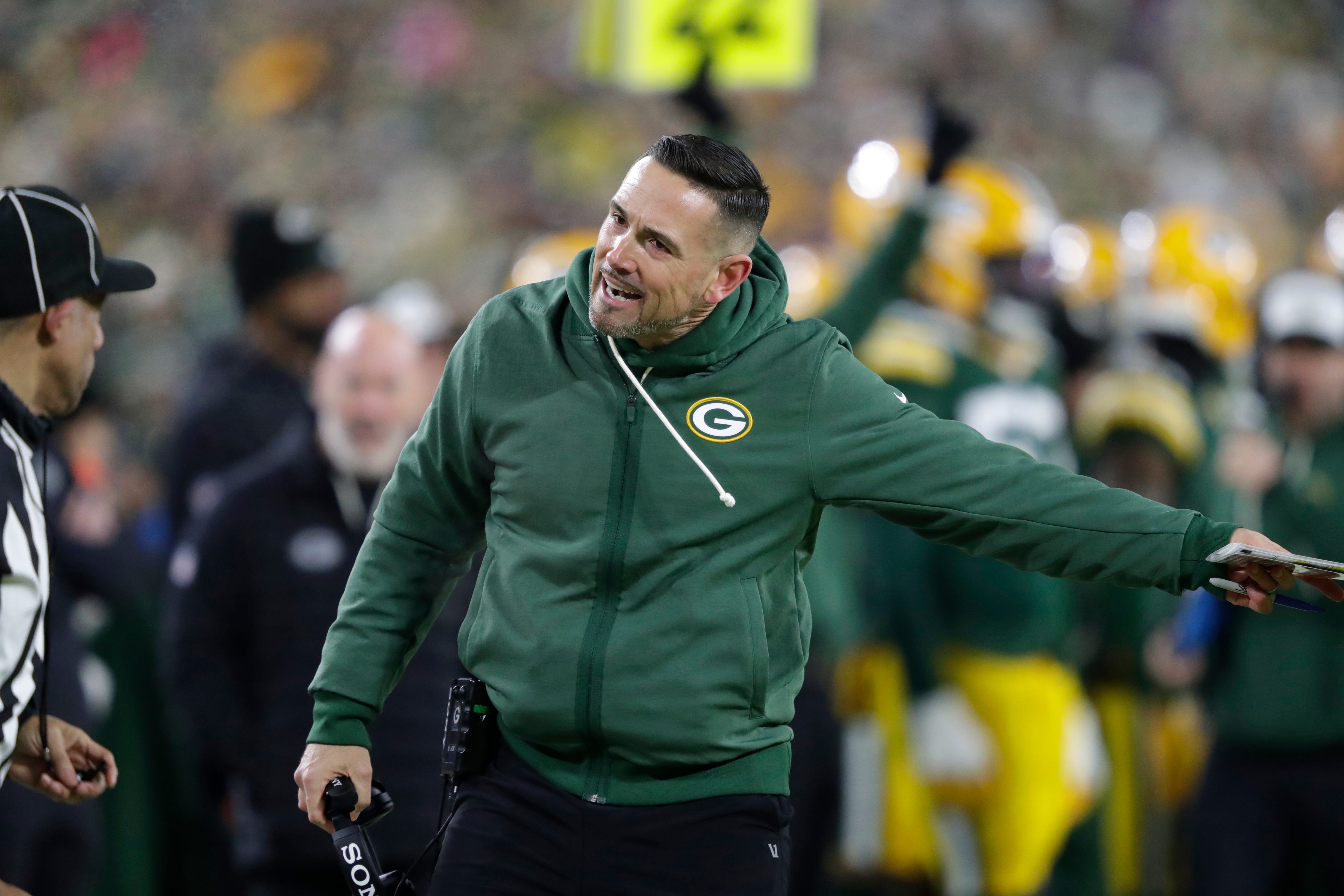 Green Bay Packers' Matt Lafleur talks to an official against the Baltimore Ravens during their football game Saturday, December 27, 2025, at Lambeau Field in Green Bay, Wisconsin.