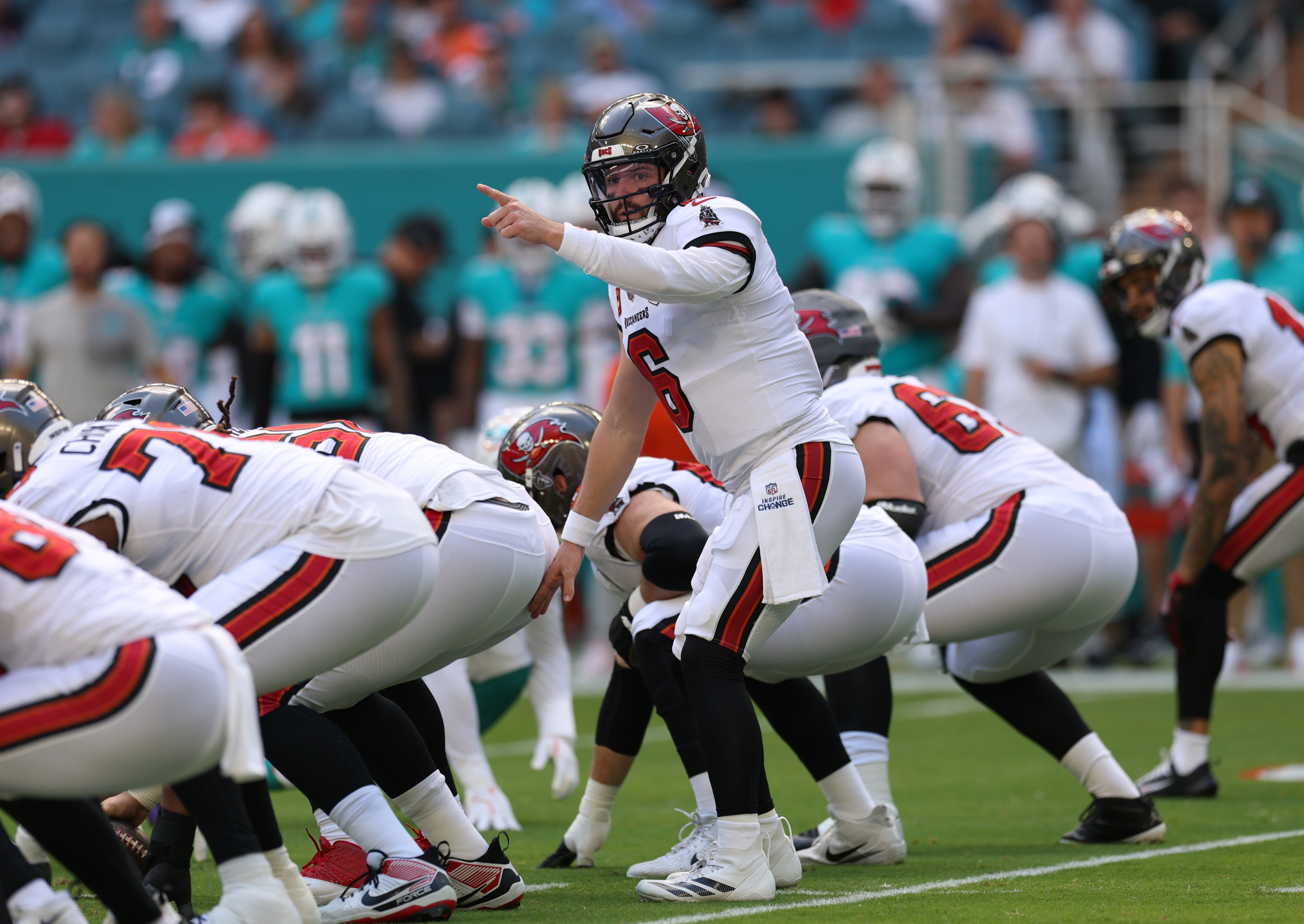 Dec 28, 2025; Miami Gardens, Florida, USA; Tampa Bay Buccaneers quarterback Baker Mayfield (6) directs a play during the first quarter against the Miami Dolphins at Hard Rock Stadium.