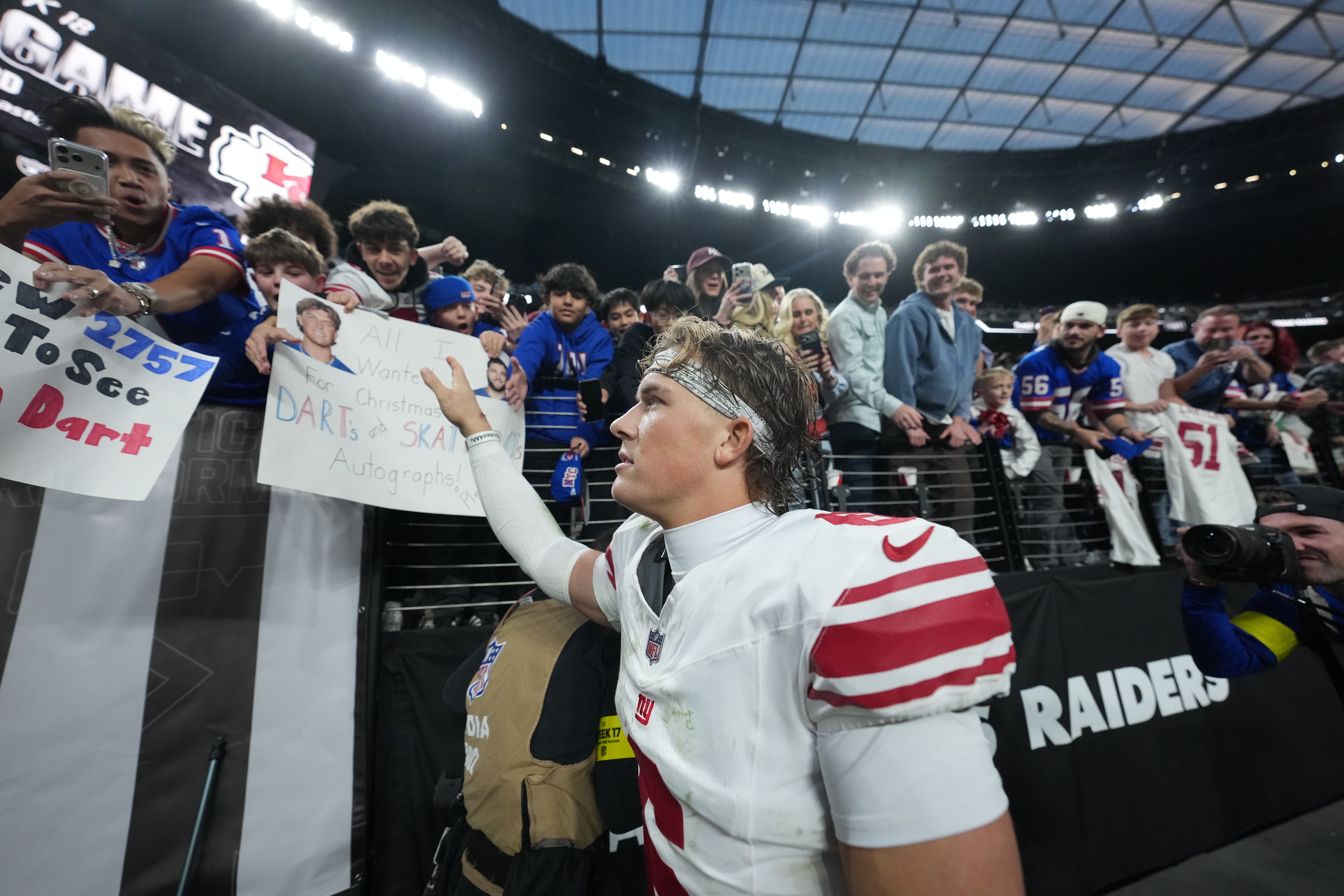 Dec 28, 2025; Paradise, Nevada, USA; New York Giants quarterback Jaxson Dart (6) greets fans after the game against the Las Vegas Raiders at Allegiant Stadium.