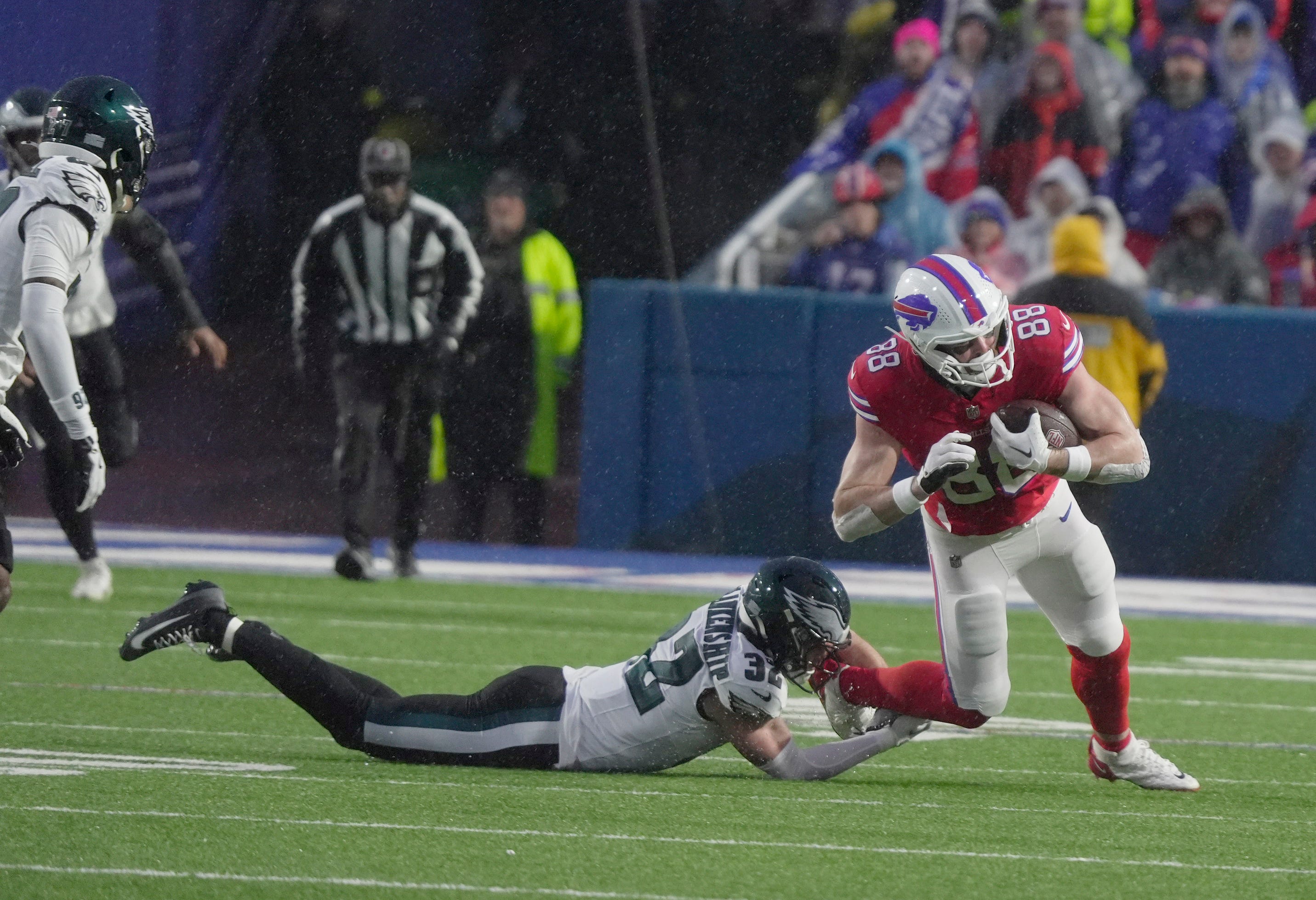 Philadelphia Eagles safety Reed Blankenship trips up Buffalo Bills tight end Dawson Knox after Knox catches the pass during first half action against the Philadelphia Eagles at Highmark Stadium in Orchard Park on Dec. 28, 2025.
