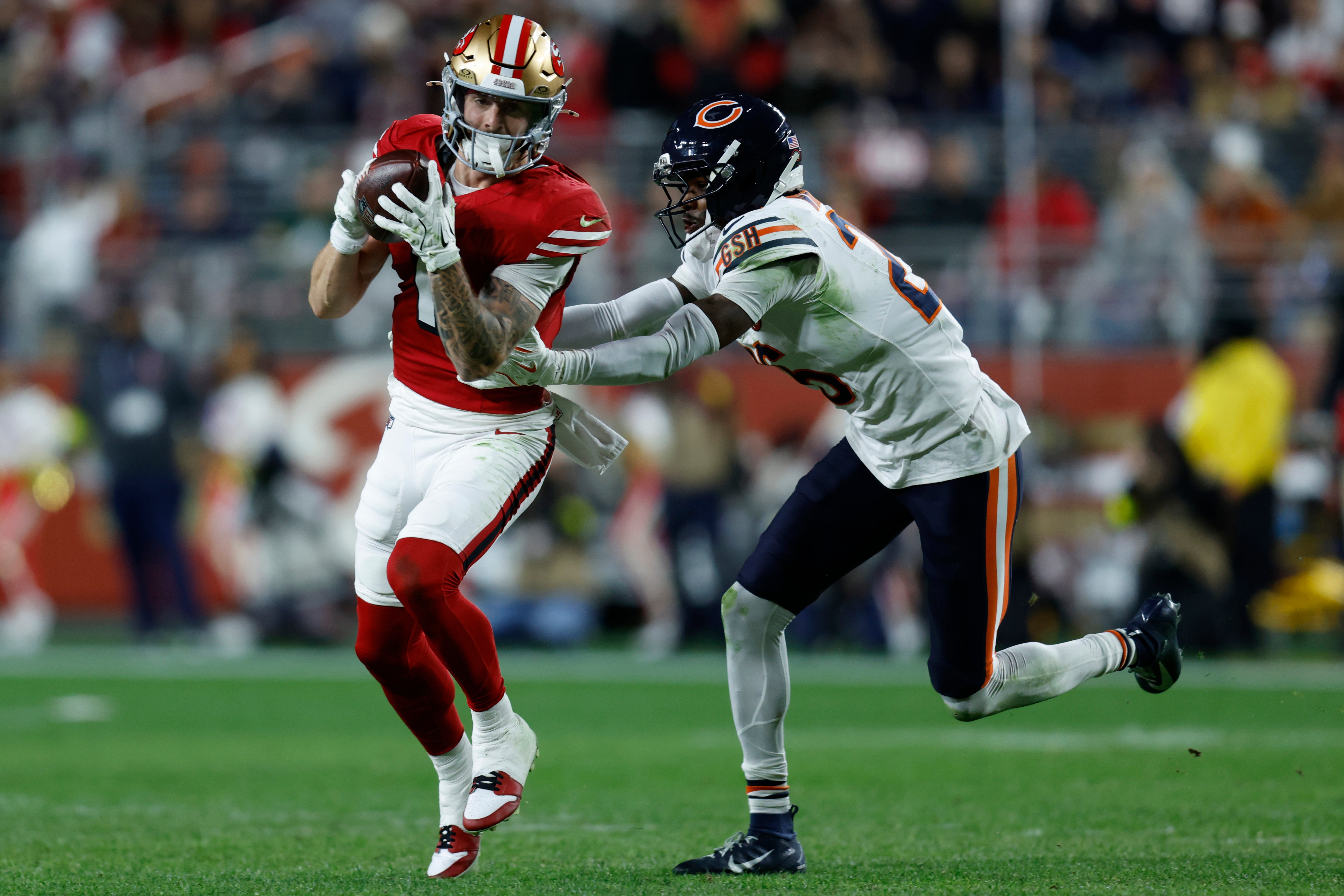 Dec 28, 2025; Santa Clara, California, USA; San Francisco 49ers wide receiver Ricky Pearsall (1) makes a catch against Chicago Bears cornerback Nahshon Wright (26) in the first half at Levi's Stadium.