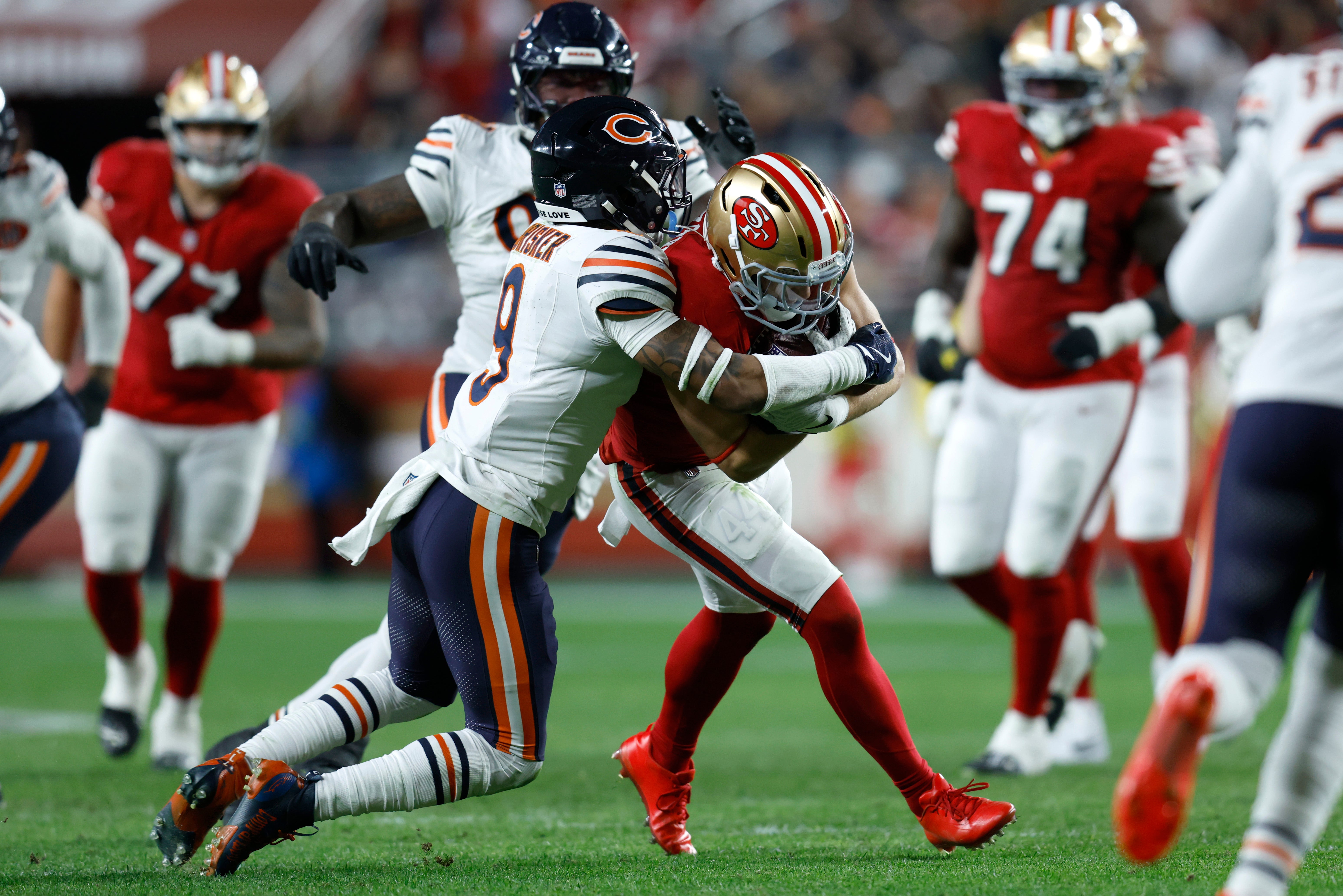 Dec 28, 2025; Santa Clara, California, USA; Chicago Bears safety Jaquan Brisker (9) tackles San Francisco 49ers fullback Kyle Juszczyk (44) in the second half at Levi's Stadium.