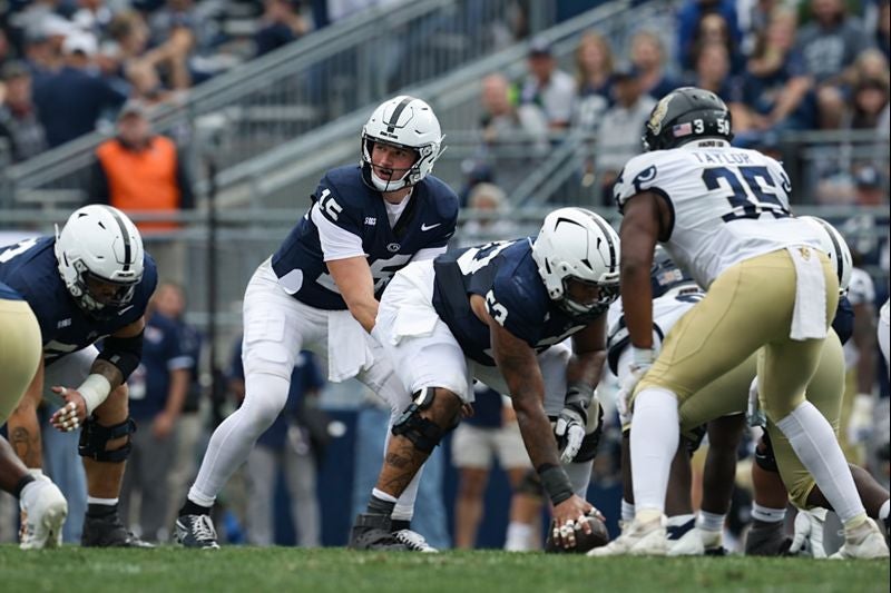 Sep 6, 2025; University Park, Pennsylvania, USA; Penn State Nittany Lions quarterback Drew Allar (15) lines up behind center Nick Dawkins (53) during the third quarter against the Florida International Panthers at Beaver Stadium. Mandatory Credit: Matthew O'Haren-Imagn Images