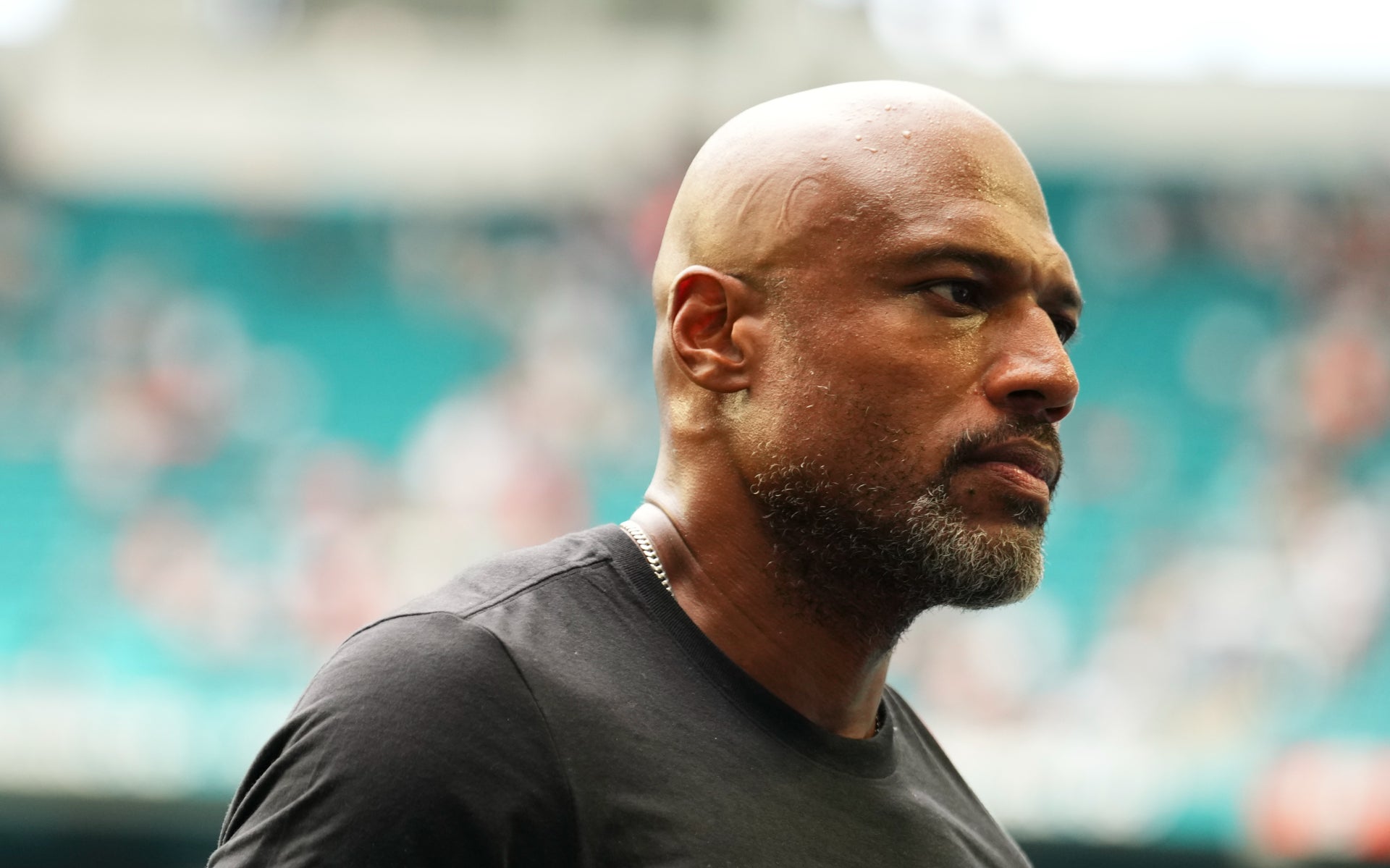 Oct 12, 2025; Miami Gardens, Florida, USA; Miami Dolphins defensive coordinator Anthony Weaver leaves the field after a game between the Miami Dolphins and the Los Angeles Chargers at Hard Rock Stadium.