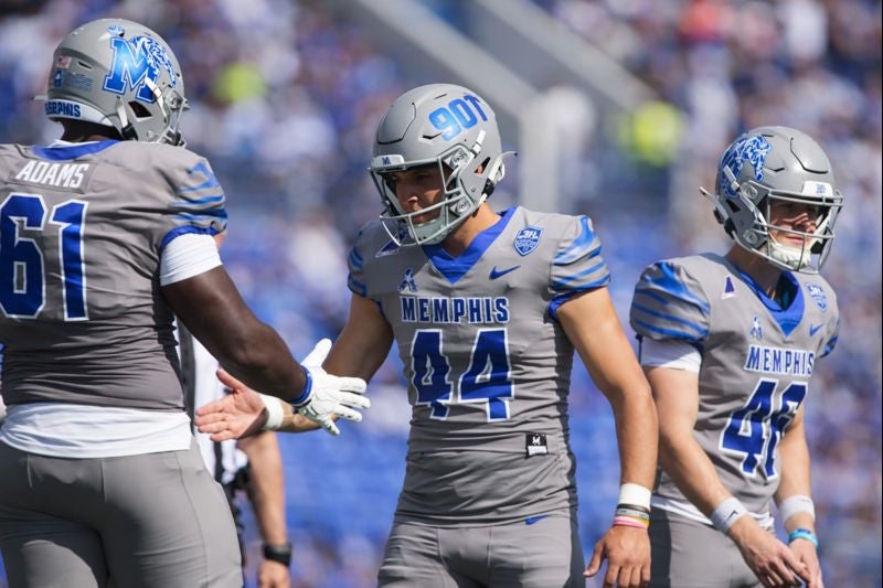 Memphis' Gianni Spetic (44) celebrates with Chris Adams (61) after making an extra point during the season opener between Chattanooga and Memphis at Simmons Bank Liberty Stadium in Memphis, Tenn., on August 30, 2025.