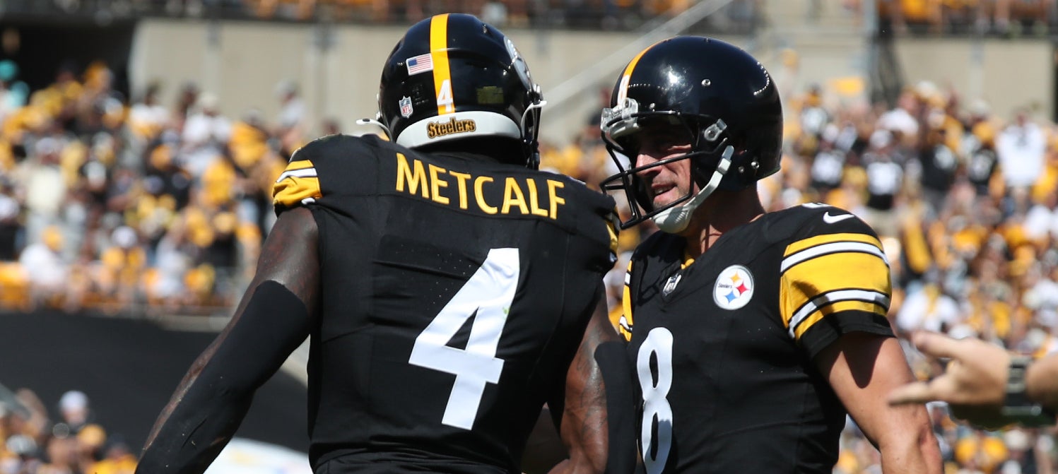 Sep 14, 2025; Pittsburgh, Pennsylvania, USA; Pittsburgh Steelers wide receiver DK Metcalf (4) and quarterback Aaron Rodgers (8) celebrate after combining for a touchdown against the Seattle Seahawks during the second quarter at Acrisure Stadium.