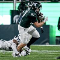 Michigan State's Michael Masunas catches a pass as Penn State's Dejuan Lane, left, attempts the tackle during the third quarter on Saturday, Nov. 15, 2025, at Spartan Stadium in East Lansing.