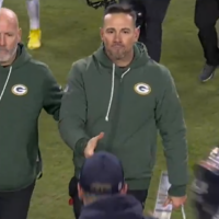 Green Bay Packers head coach Matt LaFleur greets Chicago Bears head coach Ben Johnson after the game.