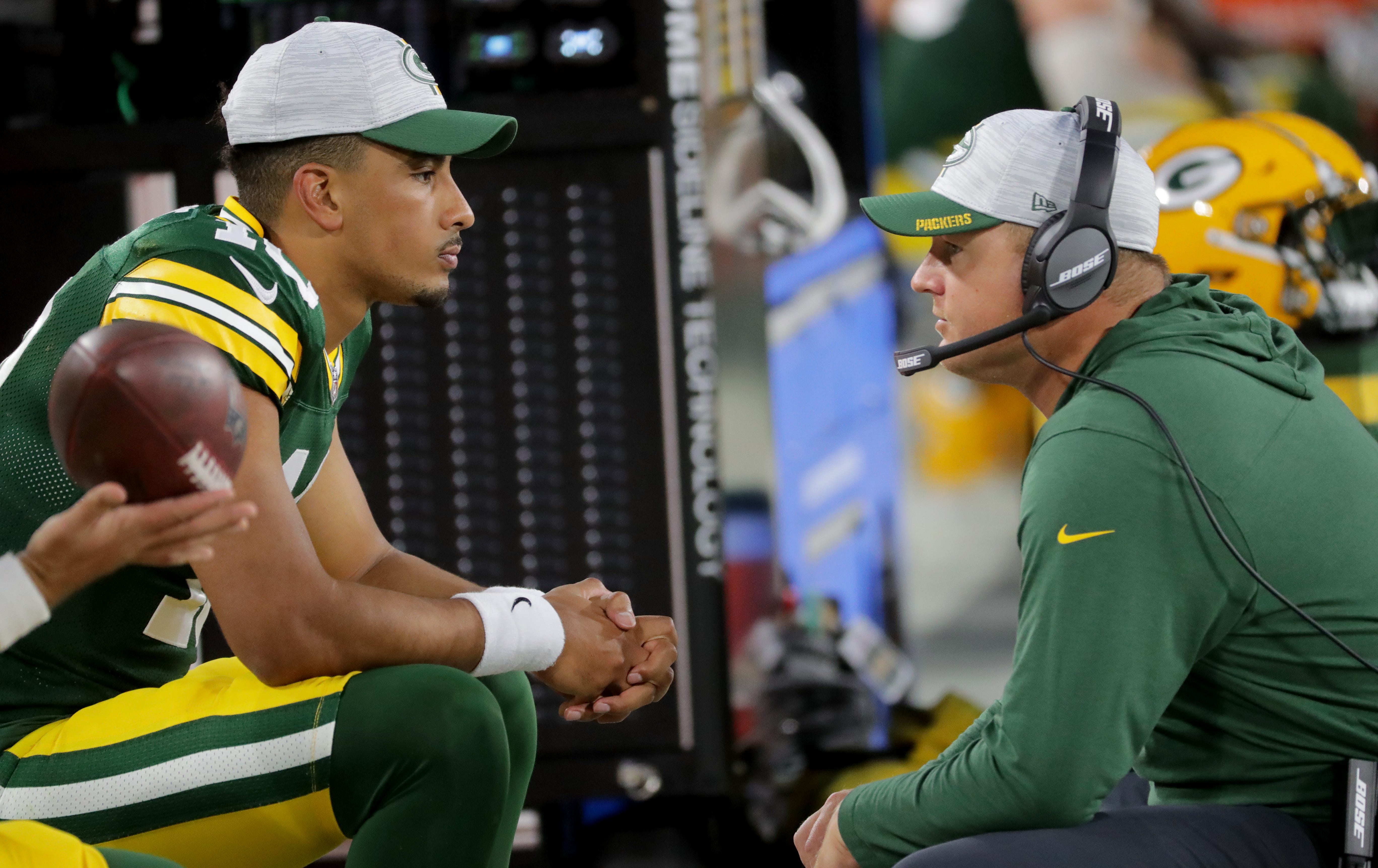 Green Bay Packers quarterback Jordan Love (10) talks with quarterback coach Luke Getsy during their preseason game at Lambeau Field in Green Bay. The Houston Texans beat the Green Bay Packers 26-7.