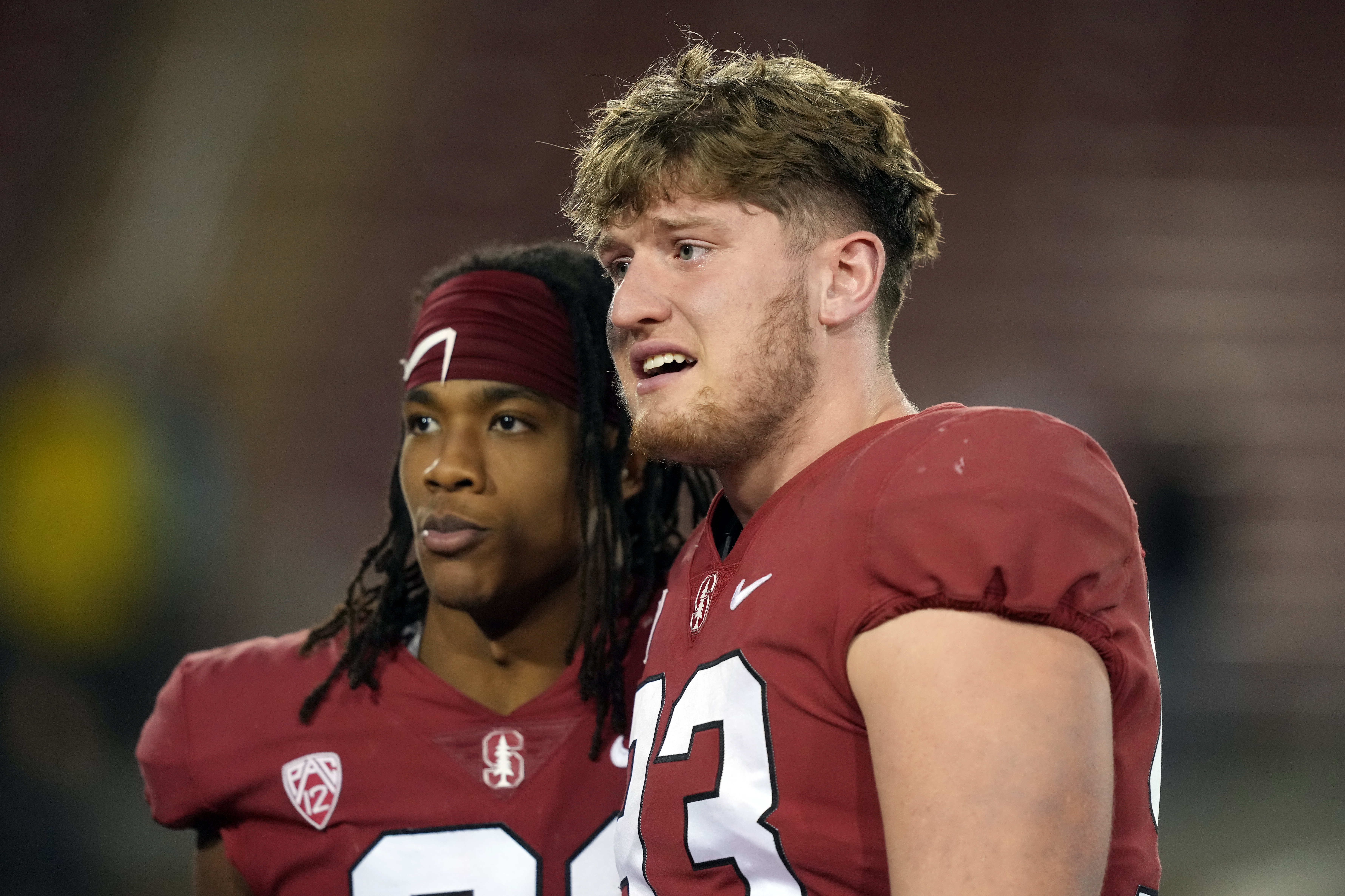 Nov 27, 2021; Stanford, California, USA; Stanford Cardinal defensive end Trey LaBounty (93) walks off the field with safety Kendall Williamson (21) after the game against the Notre Dame Fighting Irish at Stanford Stadium.