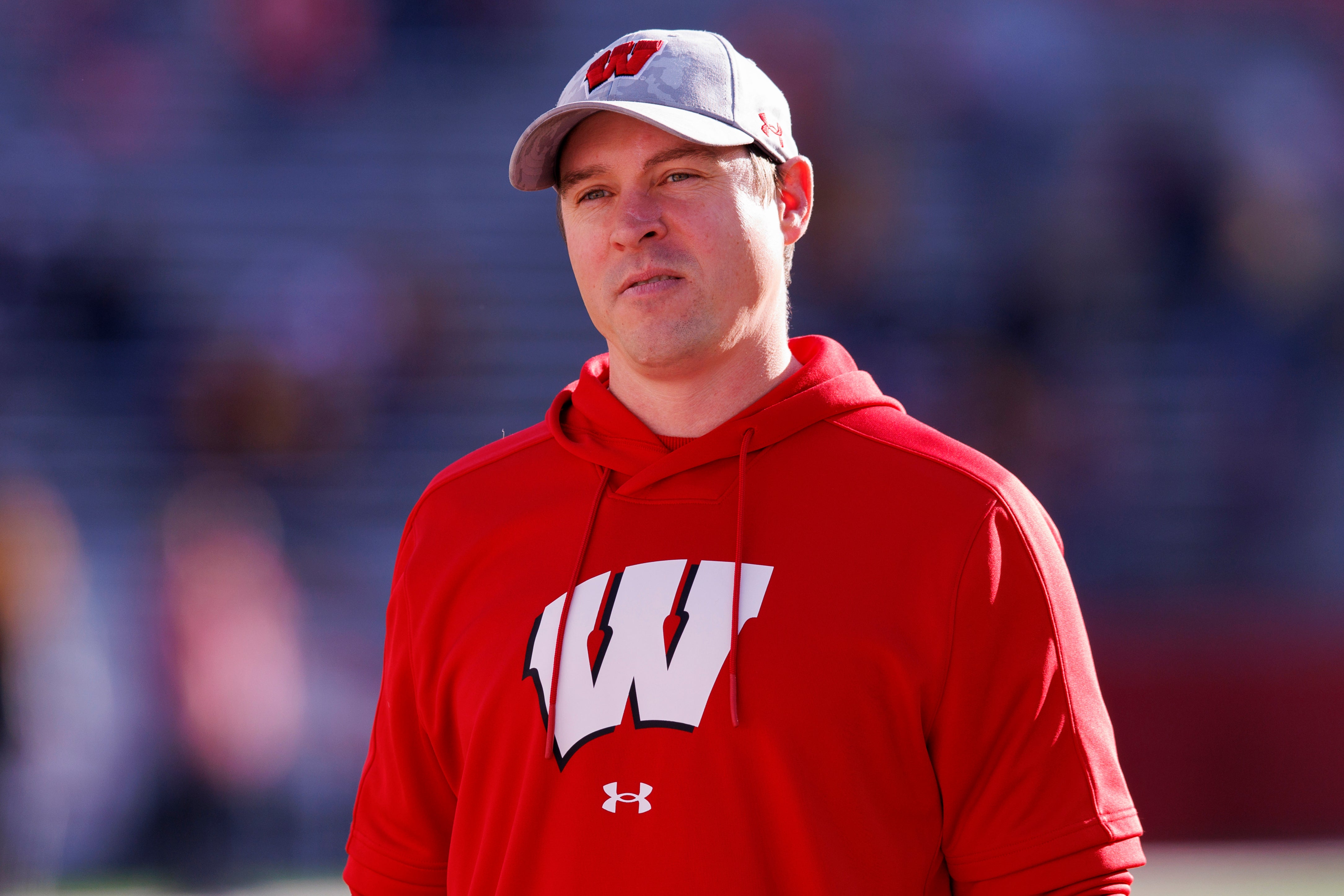 Nov 26, 2022; Madison, Wisconsin, USA; Wisconsin Badgers head coach Jim Leonhard looks on during warmups prior to the game against the Minnesota Golden Gophers at Camp Randall Stadium.