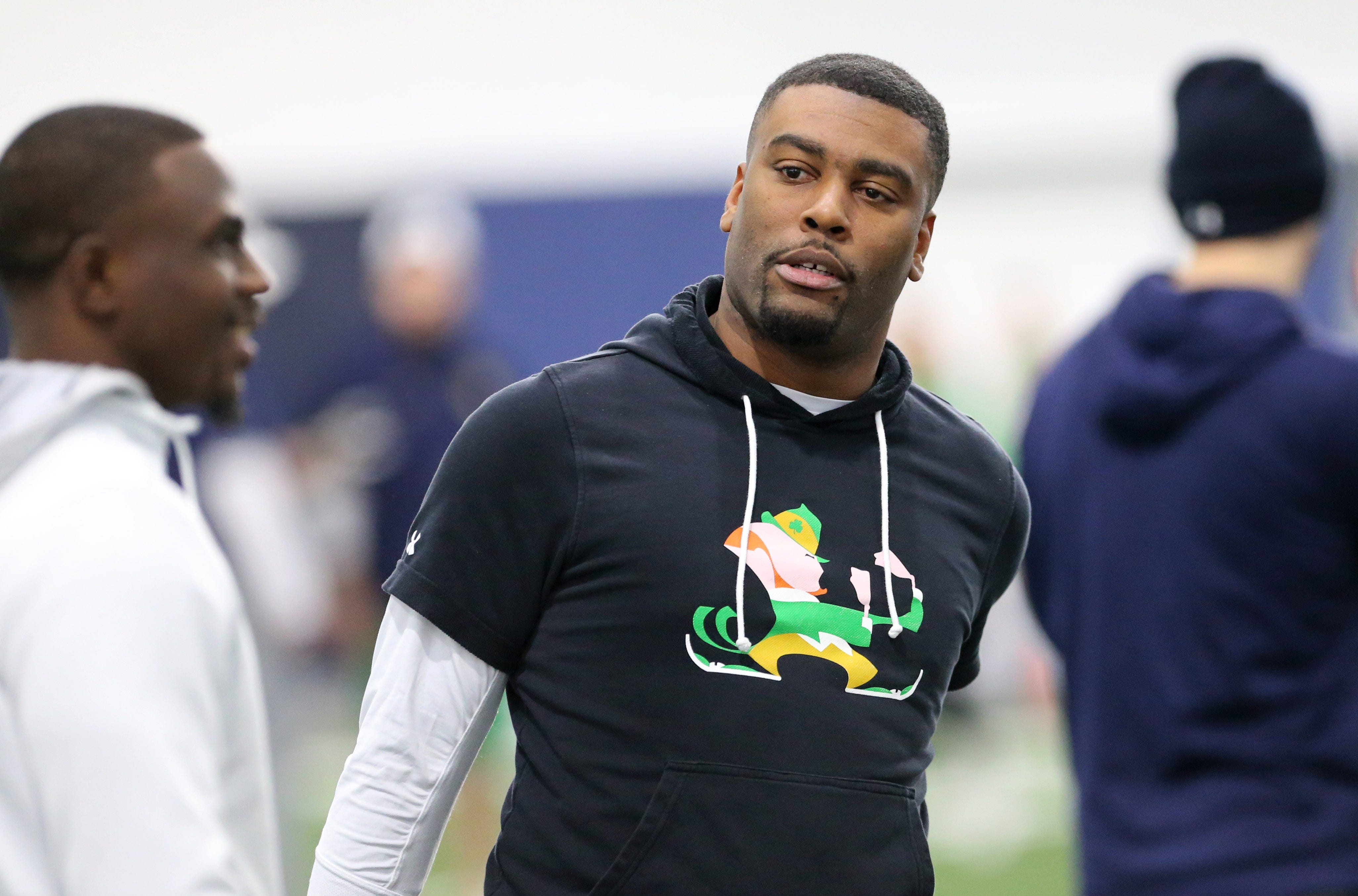 Notre Dame cornerbacks coach Mike Mickens speaks to former Irish cornerback TaRiq Bracy Saturday, March 25, 2023, at Notre Dame spring football practice in South Bend.