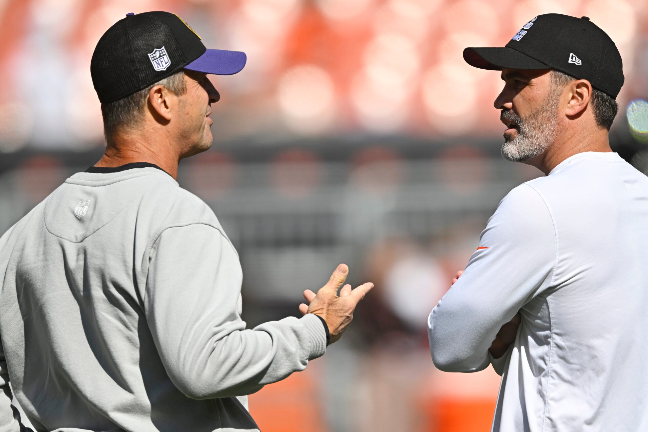 Oct 1, 2023; Cleveland, Ohio, USA; Baltimore Ravens head coach John Harbaugh (left) talks with Cleveland Browns head coach Kevin Stefanski before a game at Cleveland Browns Stadium.