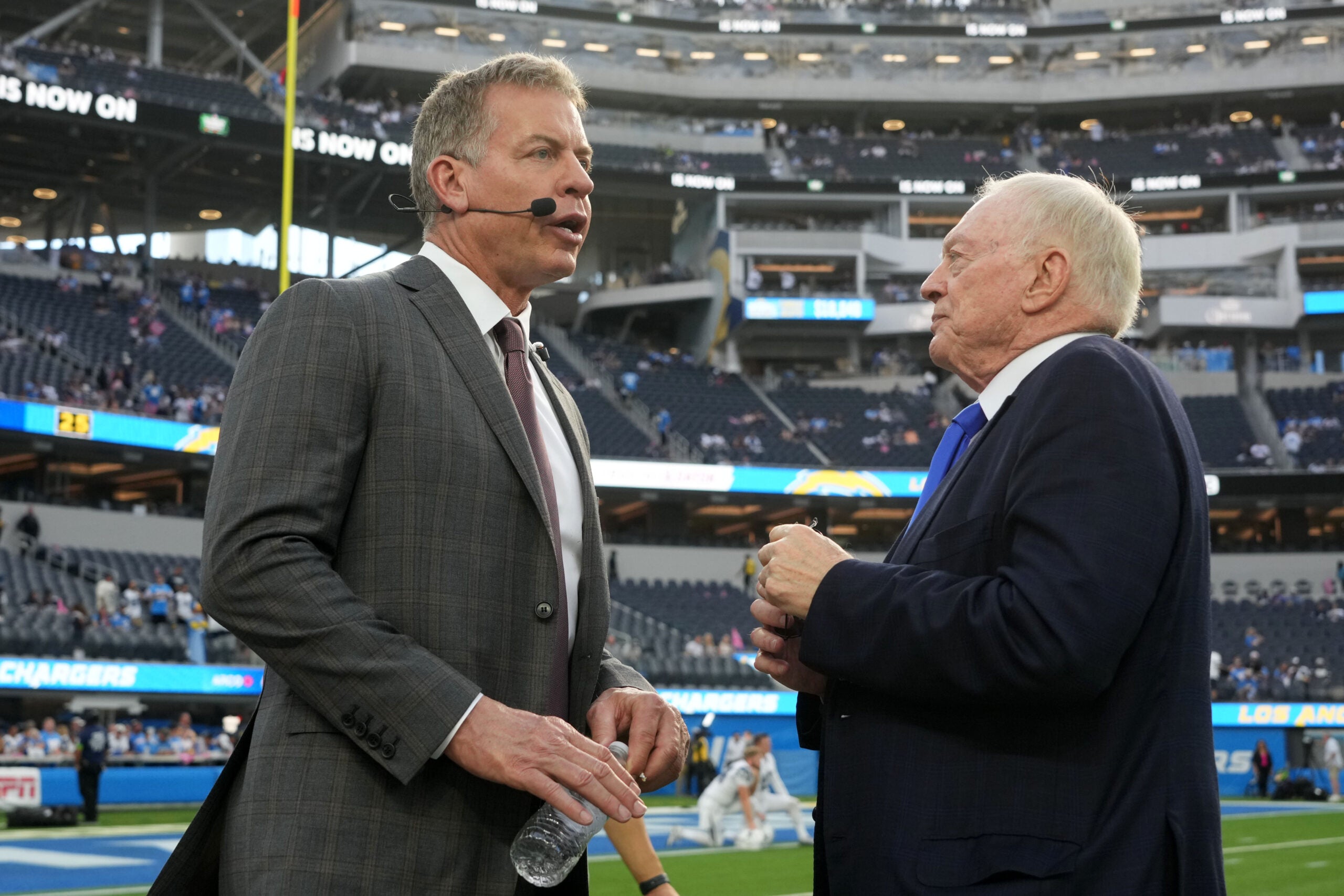 Oct 16, 2023; Inglewood, California, USA; Dallas Cowboys owner Jerry Jones (right) talks with former quarterback Troy Aikman before the game against the Los Angeles Chargers at SoFi Stadium.
