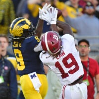 Jan 1, 2024; Pasadena, CA, USA; Alabama Crimson Tide wide receiver Kendrick Law (19) cannot make a catch against Michigan Wolverines defensive back Rod Moore (9) in the second quarter in the 2024 Rose Bowl college football playoff semifinal game at Rose Bowl.