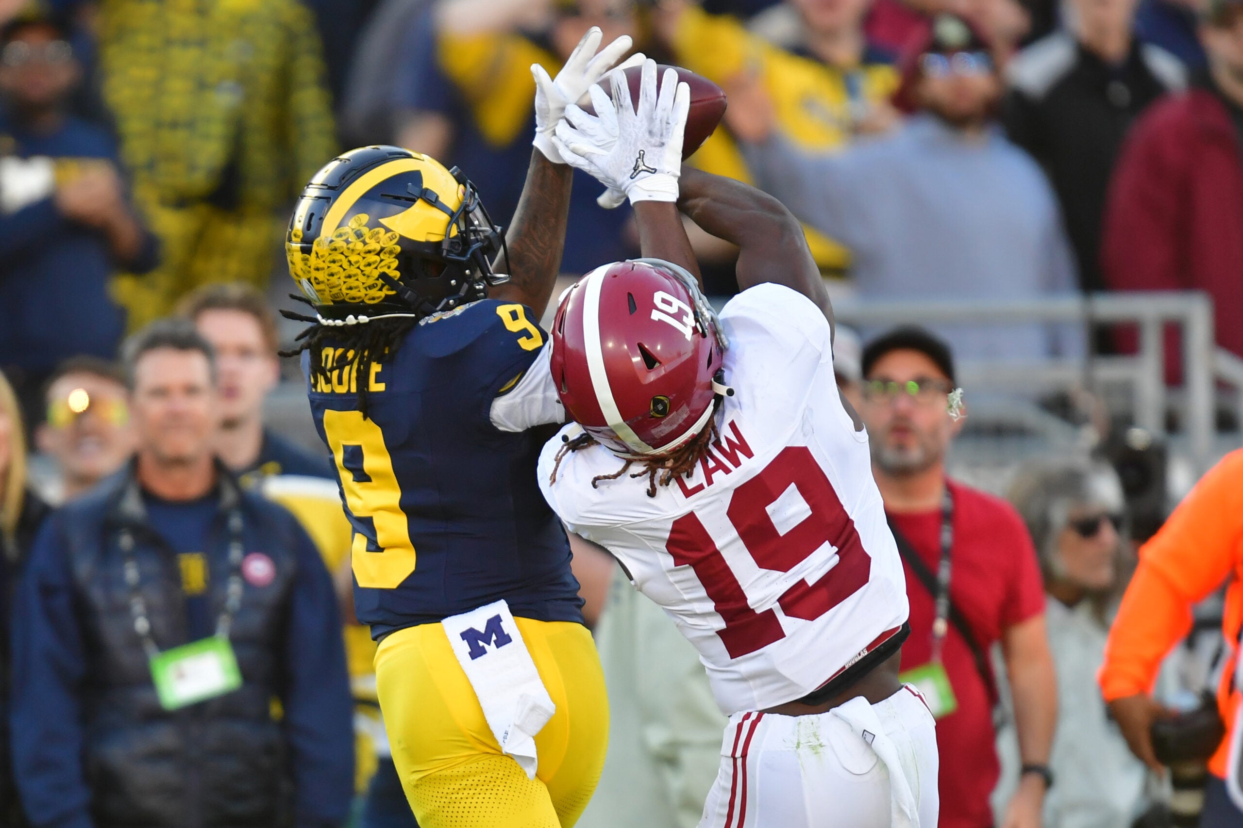 Jan 1, 2024; Pasadena, CA, USA; Alabama Crimson Tide wide receiver Kendrick Law (19) cannot make a catch against Michigan Wolverines defensive back Rod Moore (9) in the second quarter in the 2024 Rose Bowl college football playoff semifinal game at Rose Bowl.