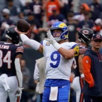 Sep 29, 2024; Chicago, Illinois, USA; Los Angeles Rams quarterback Matthew Stafford (9) warms up before the game against the Chicago Bears at Soldier Field.