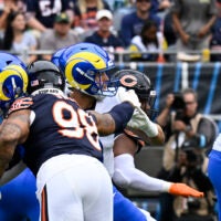 Sep 29, 2024; Chicago, Illinois, USA; Los Angeles Rams quarterback Matthew Stafford (9) is sacked and fumbles the ball by Chicago Bears defensive end Montez Sweat (98) during the first half at Soldier Field.