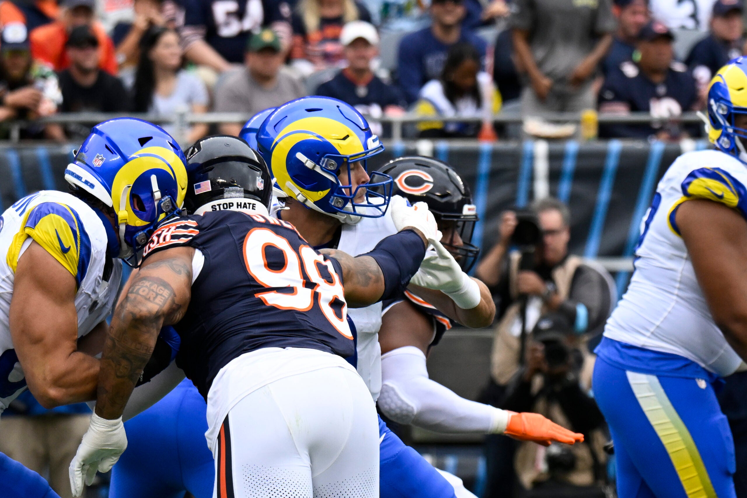 Sep 29, 2024; Chicago, Illinois, USA; Los Angeles Rams quarterback Matthew Stafford (9) is sacked and fumbles the ball by Chicago Bears defensive end Montez Sweat (98) during the first half at Soldier Field.