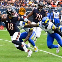 Sep 29, 2024; Chicago, Illinois, USA; Los Angeles Rams linebacker Jared Verse (8) chases Chicago Bears quarterback Caleb Williams (18) during the first half at Soldier Field.