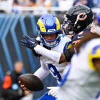 Sep 29, 2024; Chicago, Illinois, USA; Chicago Bears safety Jaquan Brisker (9) sacks Los Angeles Rams quarterback Matthew Stafford (9) during the second half at Soldier Field.