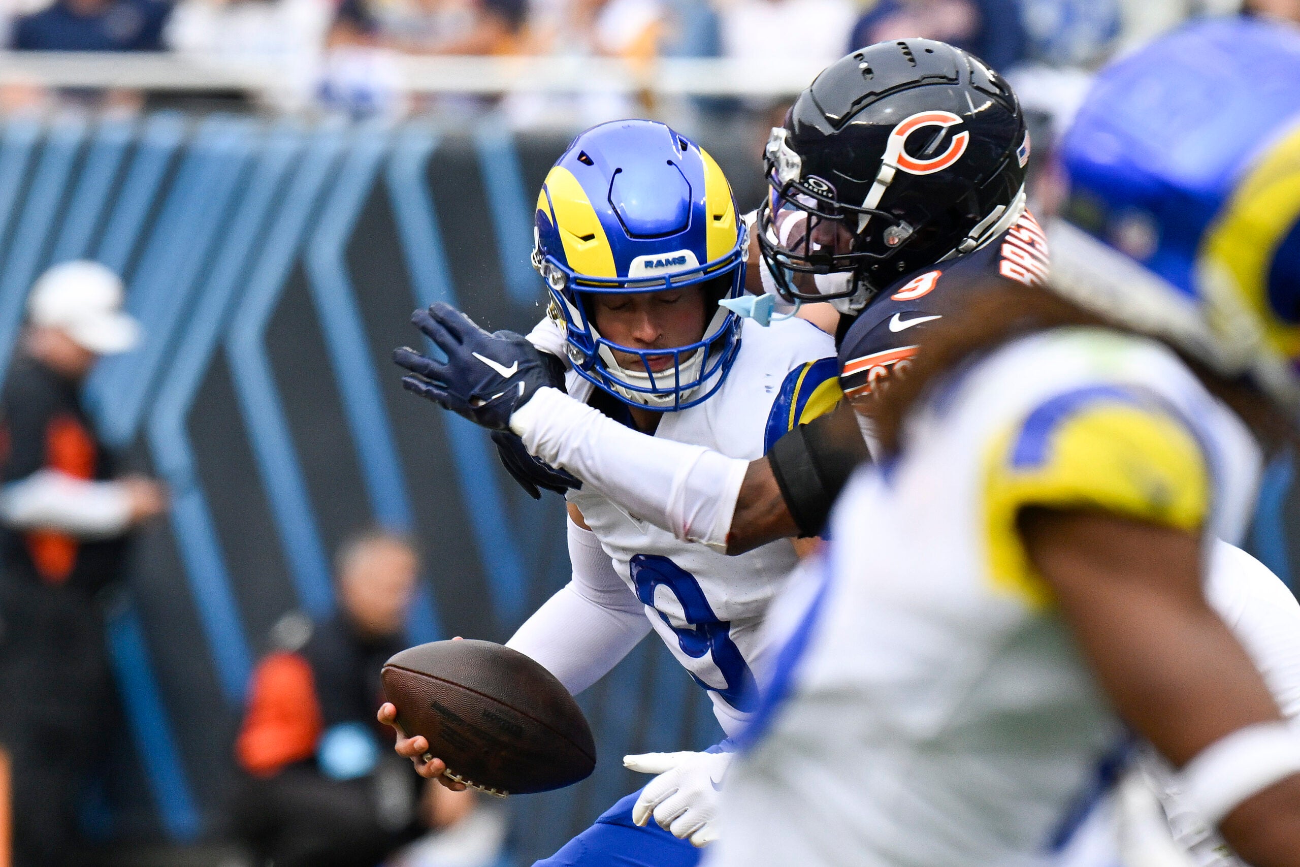 Sep 29, 2024; Chicago, Illinois, USA; Chicago Bears safety Jaquan Brisker (9) sacks Los Angeles Rams quarterback Matthew Stafford (9) during the second half at Soldier Field.