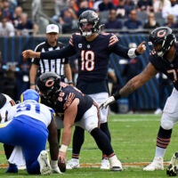 Sep 29, 2024; Chicago, Illinois, USA; Chicago Bears quarterback Caleb Williams (18) leads the team against the Los Angeles Rams during the second half at Soldier Field.