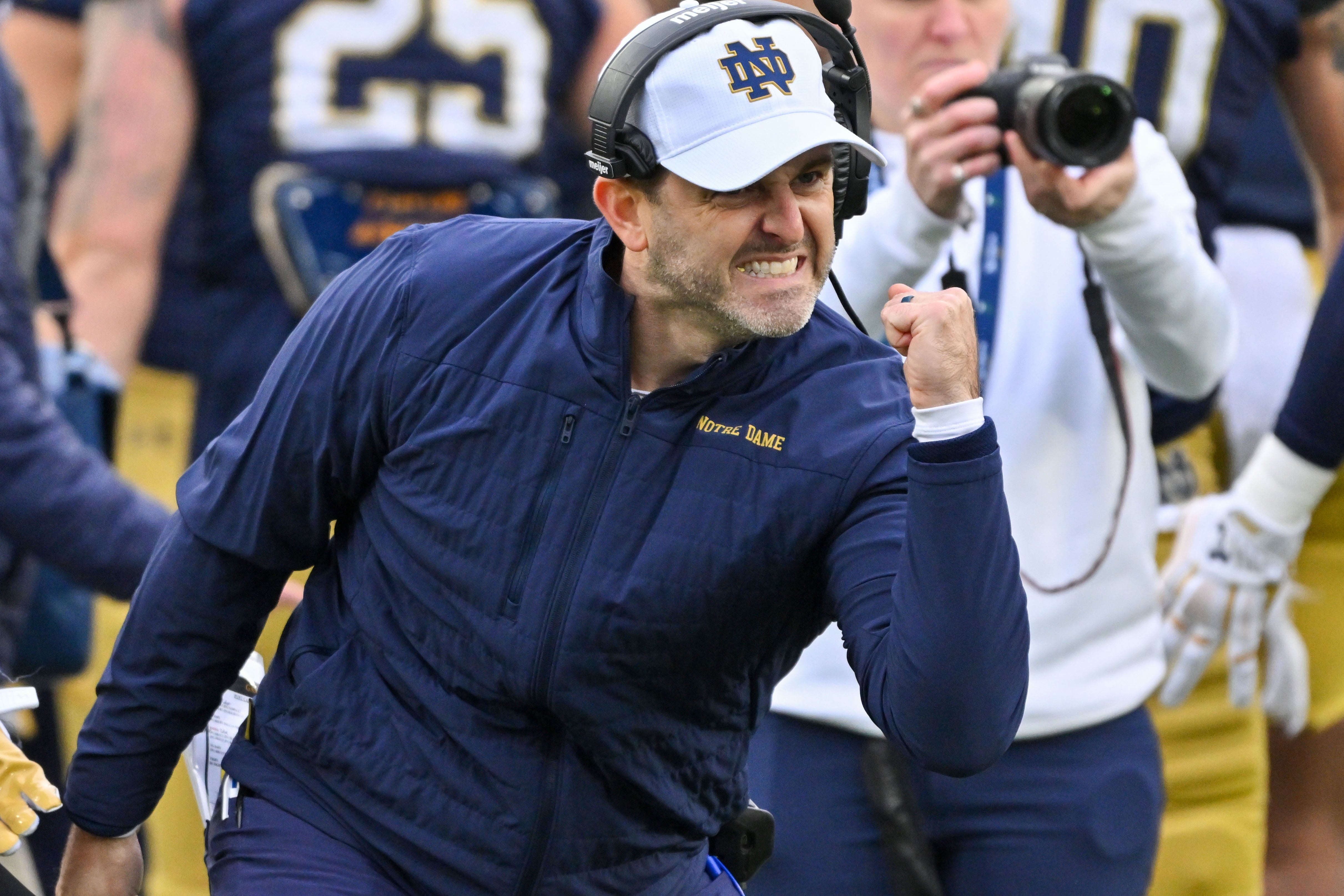 Nov 16, 2024; South Bend, Indiana, USA; Notre Dame Fighting Irish Special teams coordinator Marty Biagi celebrates in the first quarter against the Virginia Cavaliers at Notre Dame Stadium. Mandatory Credit: Matt Cashore-Imagn Images