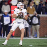 Nov 21, 2024; Atlanta, Georgia, USA; Georgia Tech Yellow Jackets quarterback Aaron Philo (12) drops back to pass against the North Carolina State Wolfpack in the third quarter at Bobby Dodd Stadium at Hyundai Field.