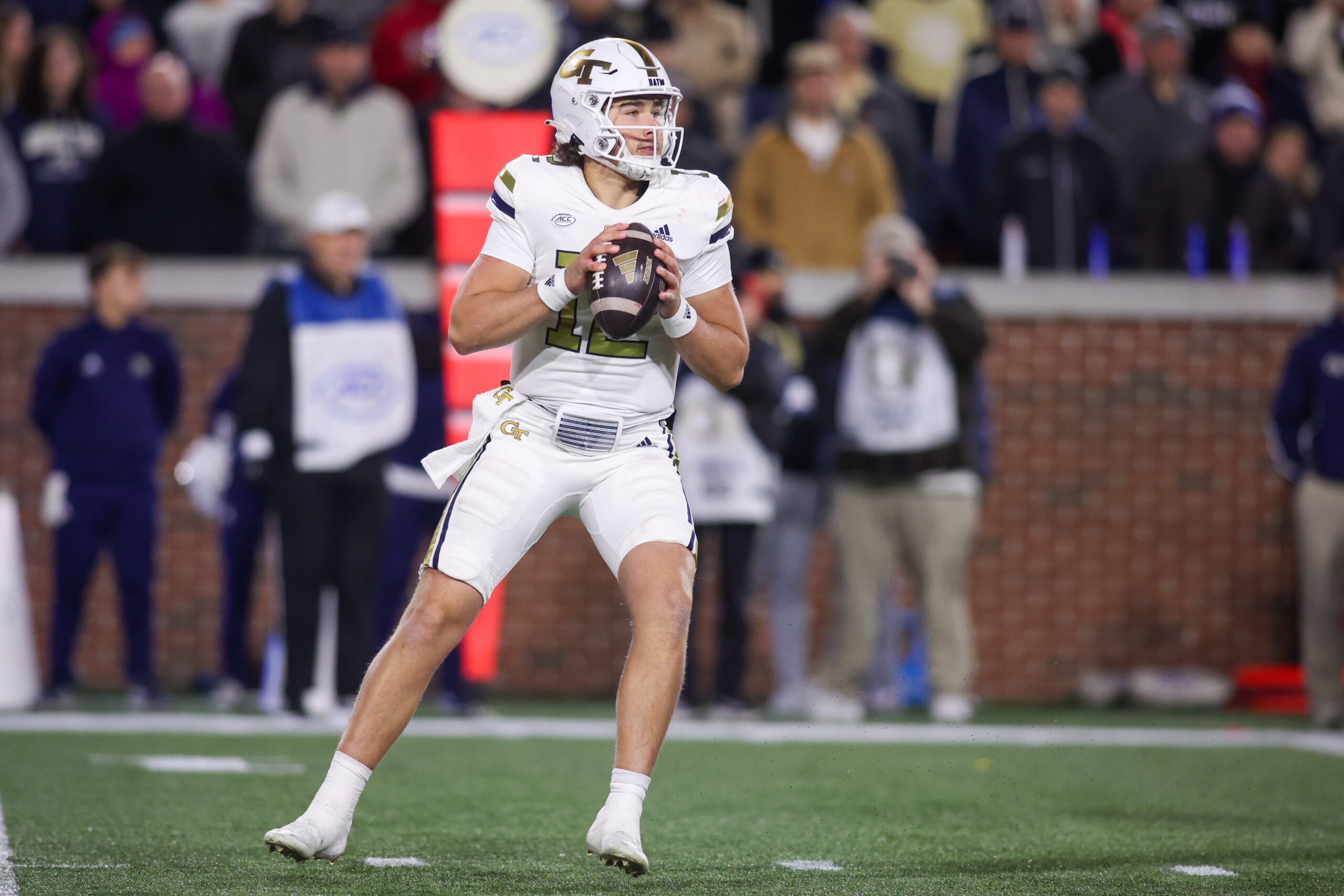 Nov 21, 2024; Atlanta, Georgia, USA; Georgia Tech Yellow Jackets quarterback Aaron Philo (12) drops back to pass against the North Carolina State Wolfpack in the third quarter at Bobby Dodd Stadium at Hyundai Field.