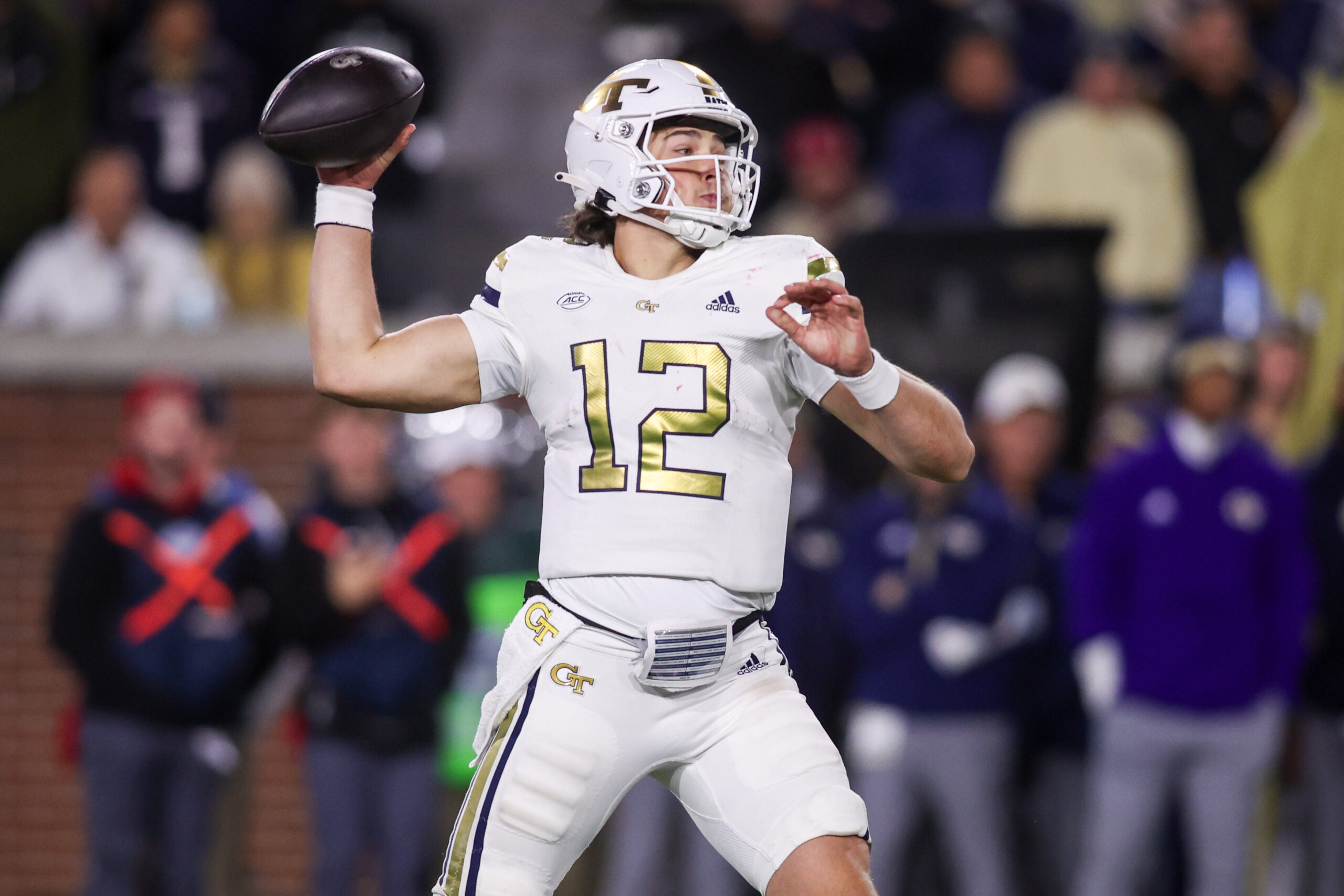 Nov 21, 2024; Atlanta, Georgia, USA; Georgia Tech Yellow Jackets quarterback Aaron Philo (12) throws a pass against the North Carolina State Wolfpack in the fourth quarter at Bobby Dodd Stadium at Hyundai Field.