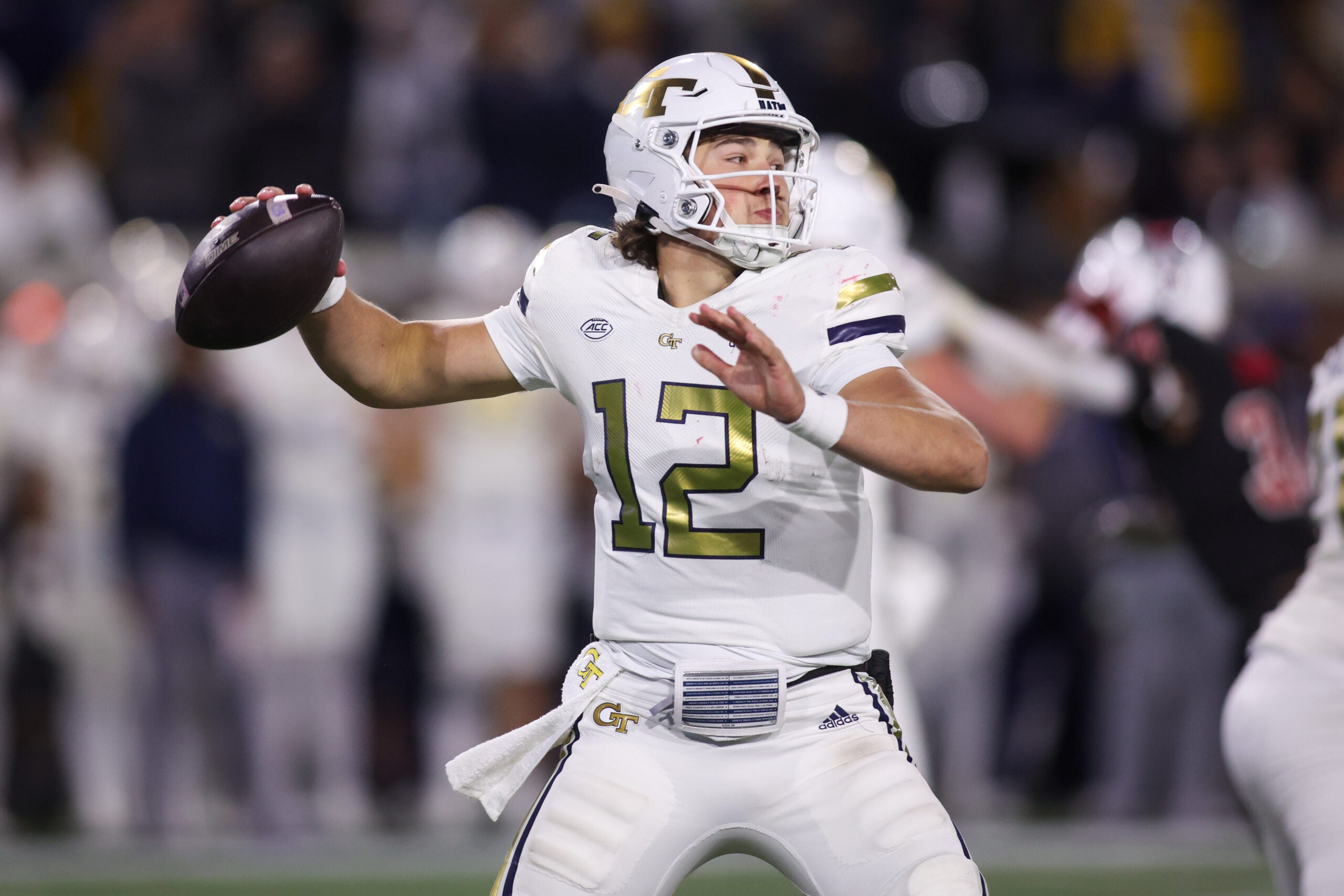 Nov 21, 2024; Atlanta, Georgia, USA; Georgia Tech Yellow Jackets quarterback Aaron Philo (12) throws a pass against the North Carolina State Wolfpack in the fourth quarter at Bobby Dodd Stadium at Hyundai Field.