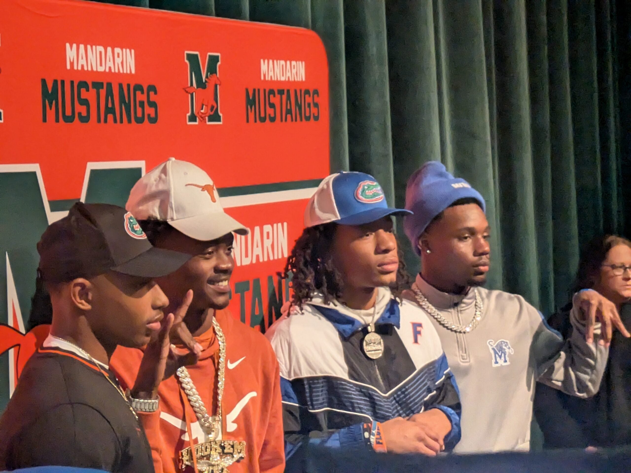Mandarin quarterback Tramell Jones Jr. (Florida), wide receiver Jaime Ffrench Jr. (Texas), safety Hylton (Drake) Stubbs (Florida) and defensive back Jaylen Lewis (Memphis) celebrate their college football signings on Dec. 4, 2024.