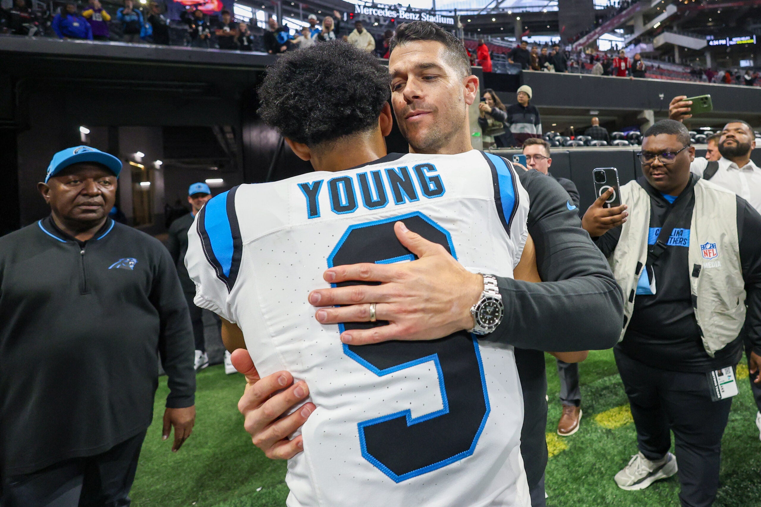 Jan 5, 2025; Atlanta, Georgia, USA; Carolina Panthers head coach Dave Canales celebrates with quarterback Bryce Young (9) after an overtime victory over the Atlanta Falcons at Mercedes-Benz Stadium.