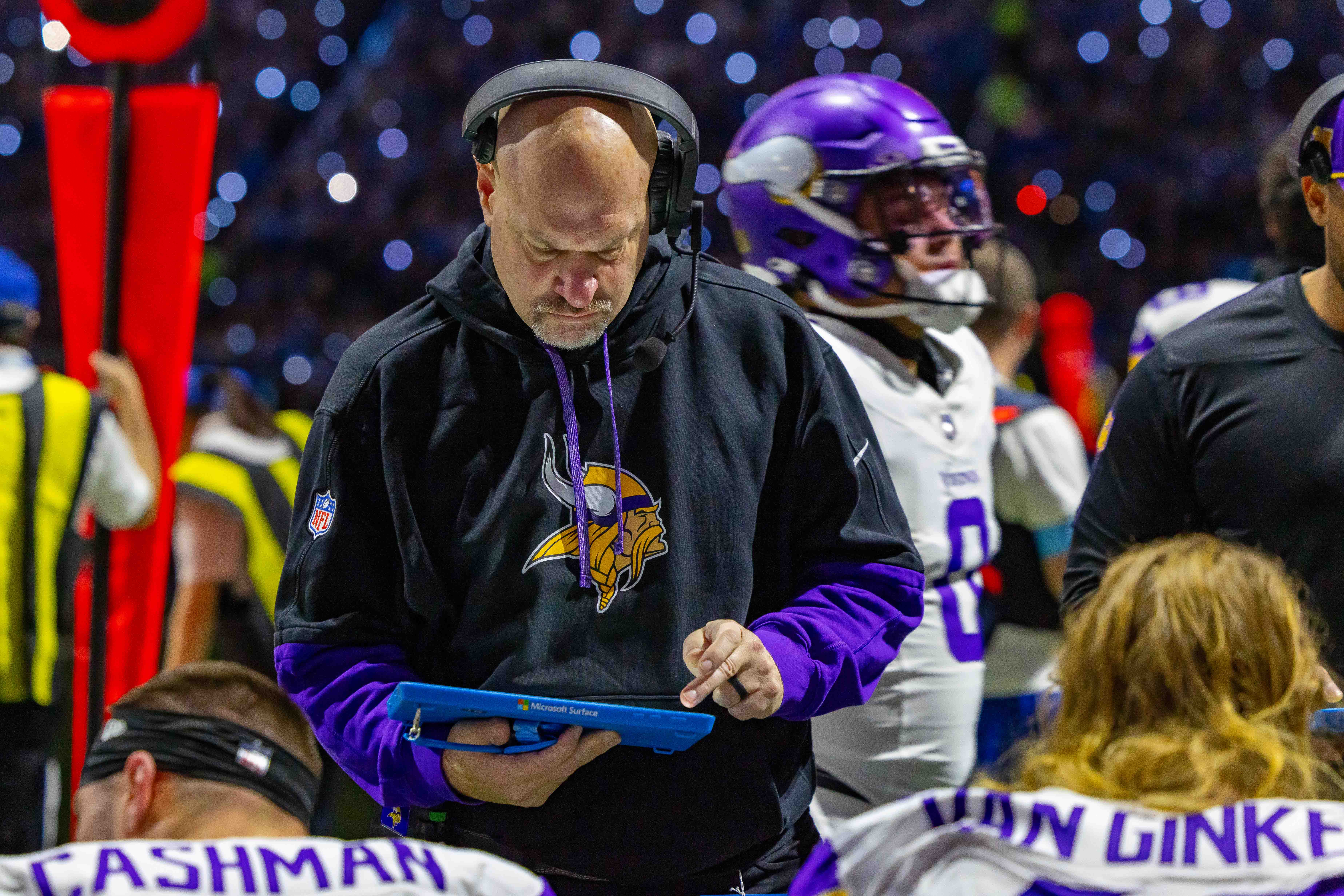 Jan 5, 2025; Detroit, Michigan, USA; Minnesota Vikings Assistant Head Coach / Outside Linebackers Mike Pettine talks to players on the bench during the first half of the game against the Detroit Lions at Ford Field.