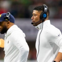 Jan 20, 2025; Atlanta, GA, USA; Notre Dame Fighting Irish head coach Marcus Freeman (right) with wide receivers coach Mike Brown against the Ohio State Buckeyes during the CFP National Championship college football game at Mercedes-Benz Stadium. Mandatory Credit: Mark J. Rebilas-Imagn Images