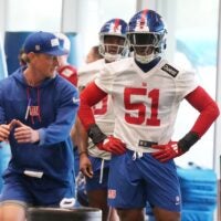Eat Rutherford, NJ -- May 9, 2025 -- Outside linebackers coach Charlie Bullen with first round draft pick Abdul Carter during practice at Giants Rookie Minicamp.