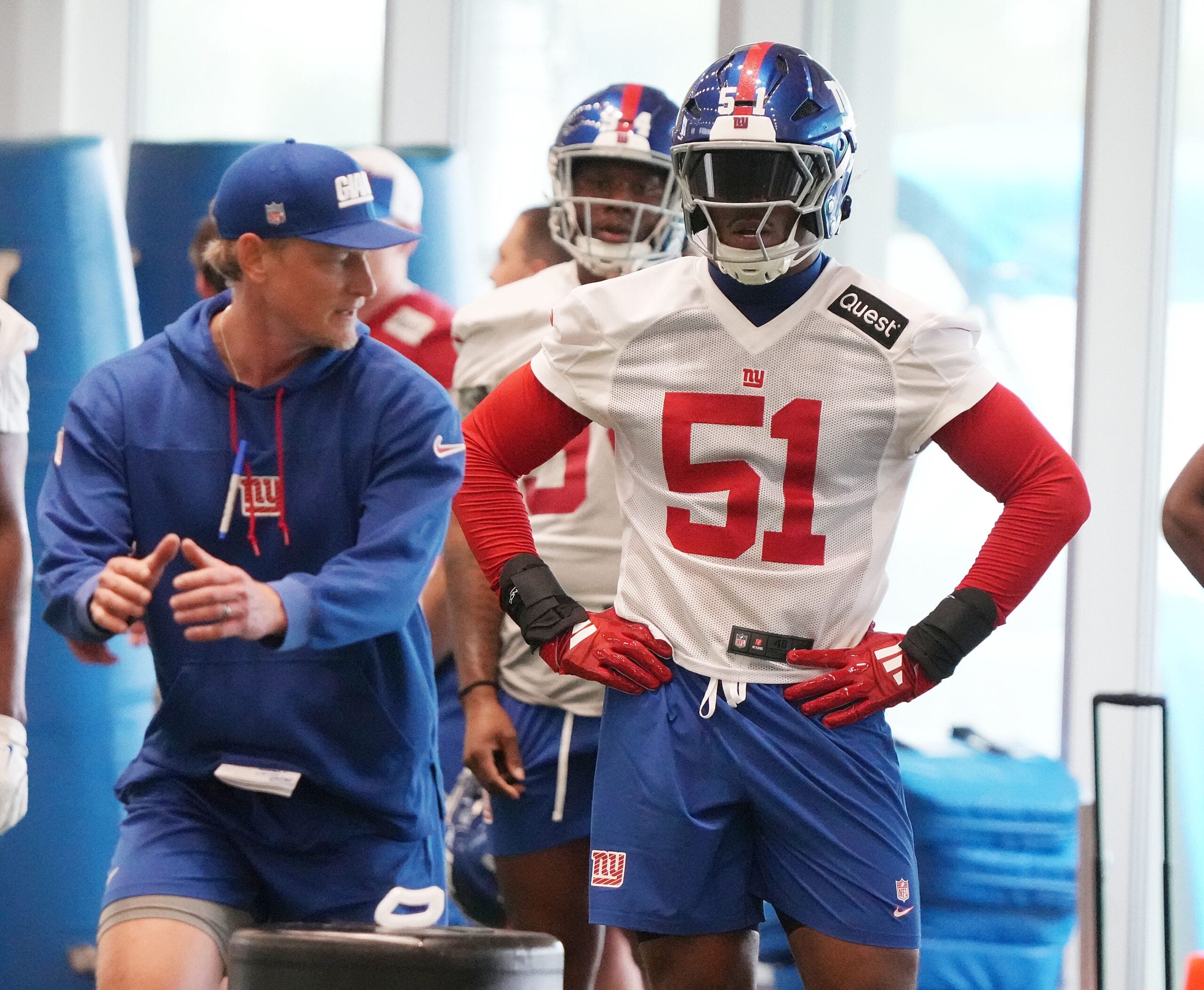 Eat Rutherford, NJ -- May 9, 2025 -- Outside linebackers coach Charlie Bullen with first round draft pick Abdul Carter during practice at Giants Rookie Minicamp.