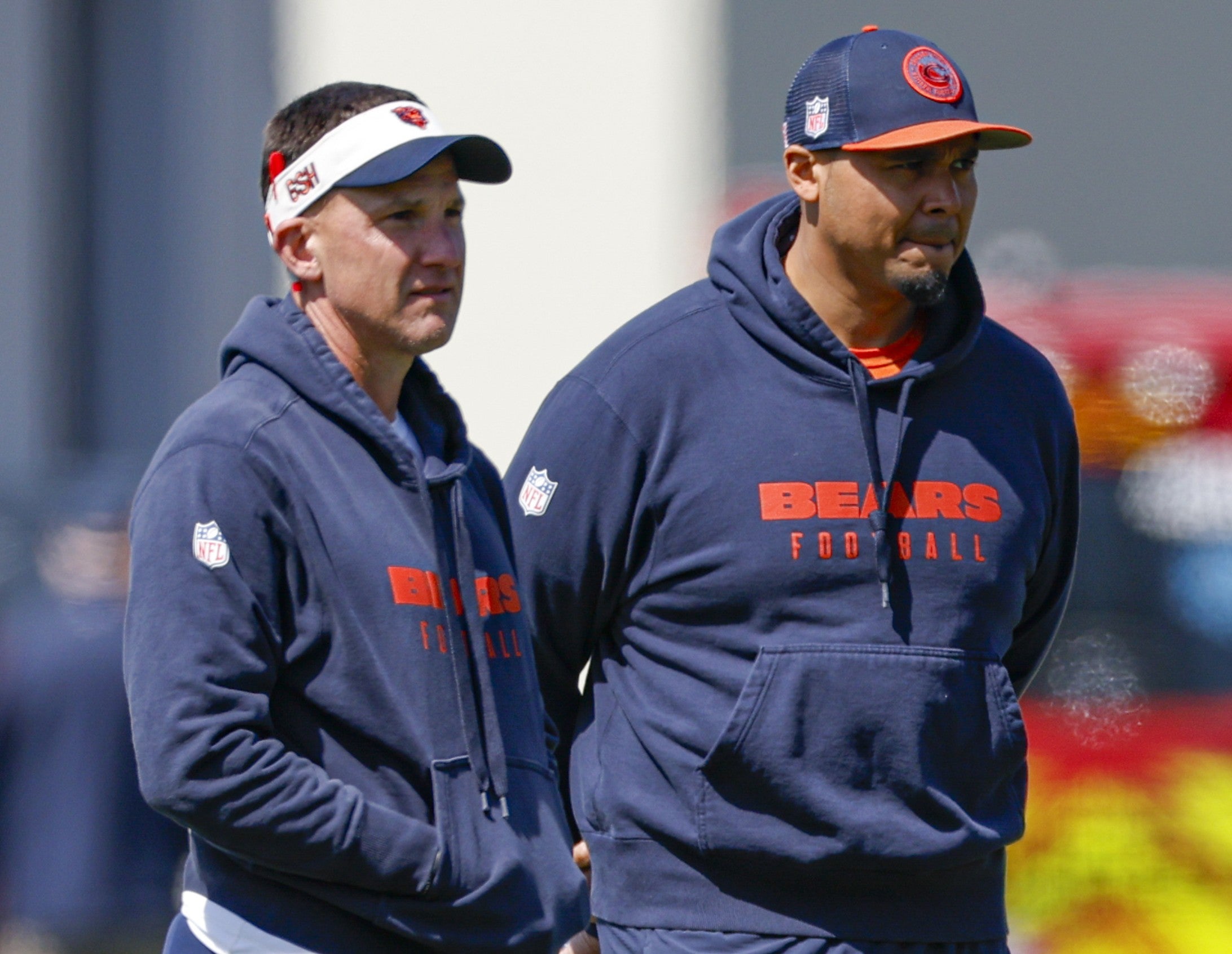 May 9, 2025; Lake Forest, IL, USA; Chicago Bears defensive coordinator Dennis Allen (L), general manager Ryan Poles (C) and head coach Ben Johnson (R) observe during the Rookie Minicamp at Halas Hall.