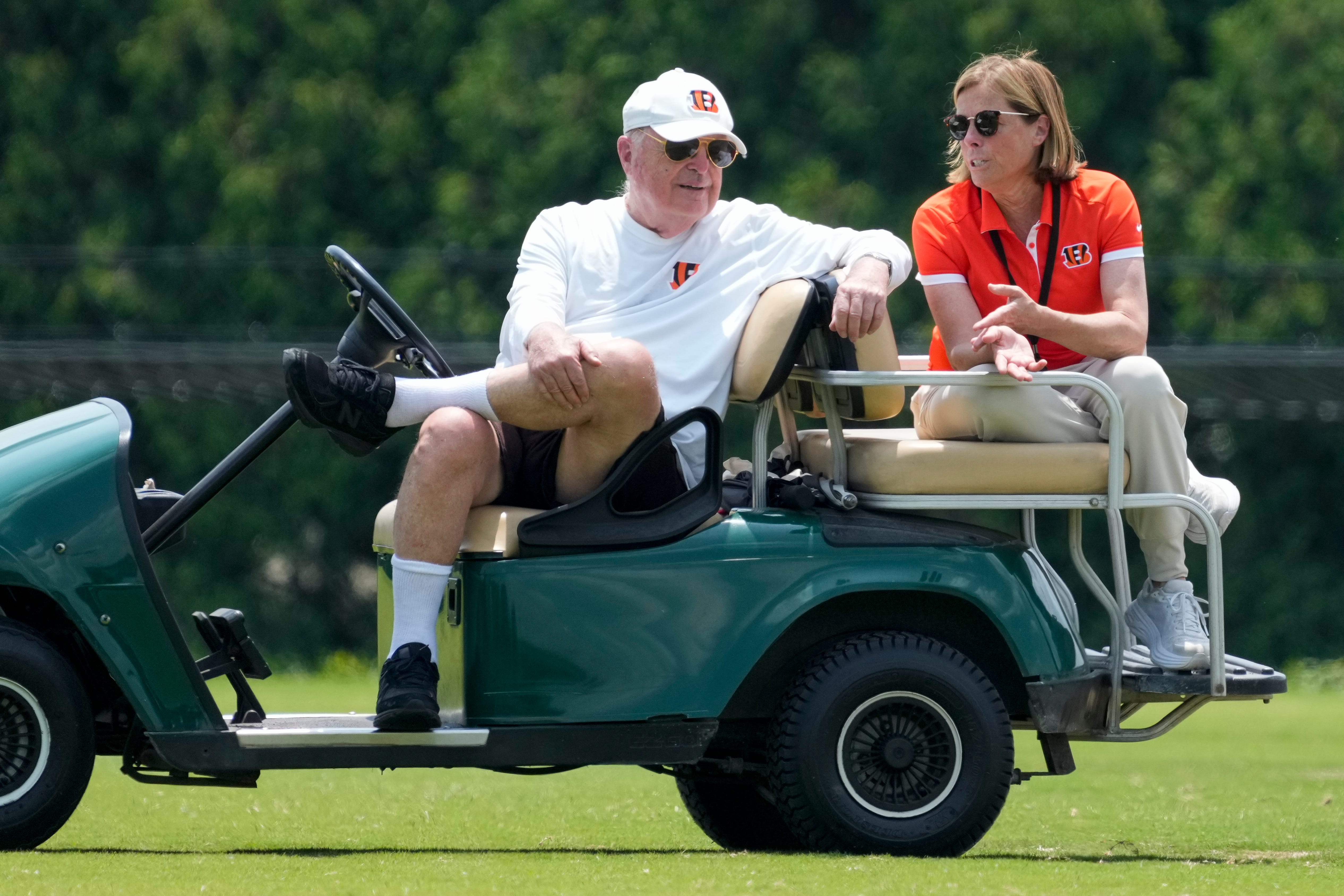 Cincinnati Bengals executives Mike Brown and his daughter Katie Blackburn talk on the sideline during a session of organized team activities on the Bengals practice field at Paycor Stadium in downtown Cincinnati on Tuesday, June 3, 2025.