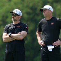 Jun 10, 2025; Cincinnati, OH, USA; Cincinnati Bengals offensive coordinator Dan Pitcher and head coach Zac Taylor talk during practice at Paycor Stadium.
