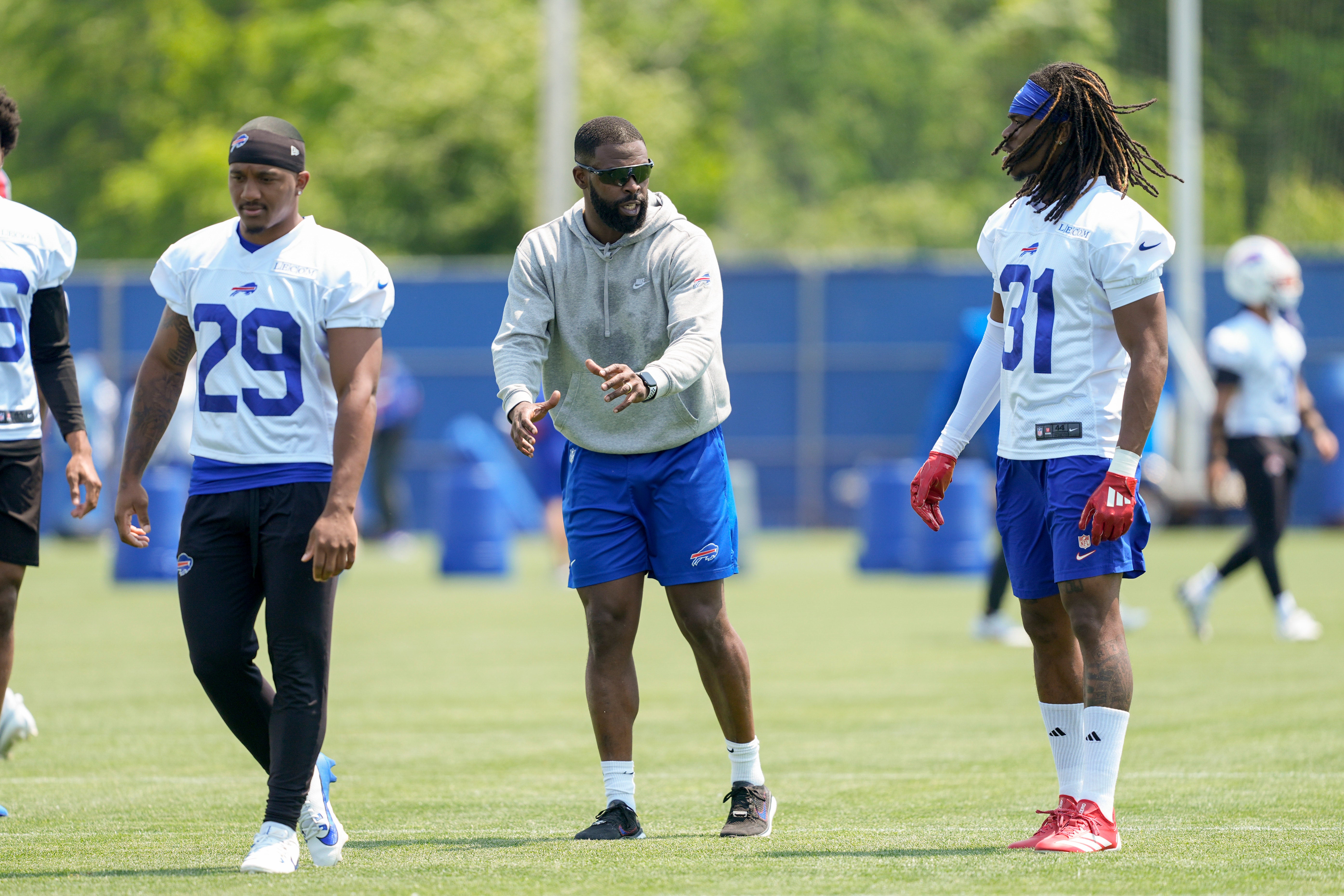 Jun 11, 2025; Orchard Park, NY, USA; Buffalo Bills cornerbacks coach Jahmile Addae coaches Buffalo Bills cornerback Maxwell Hairston (31) during Minicamp at Highmark Stadium.