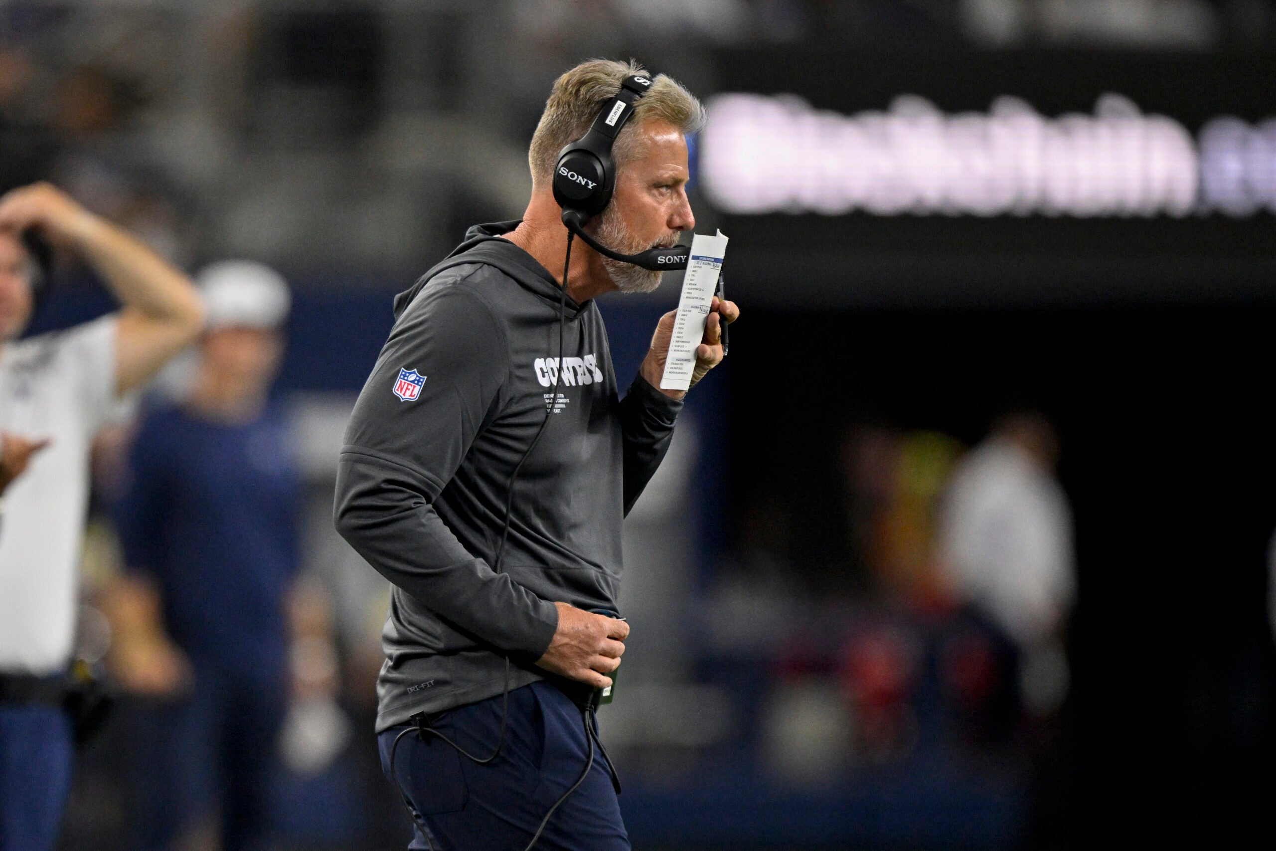 Aug 16, 2025; Arlington, Texas, USA; Dallas Cowboys defensive coordinator Matt Eberflus looks on during the game between the Dallas Cowboys and the Baltimore Ravens at AT&T Stadium.