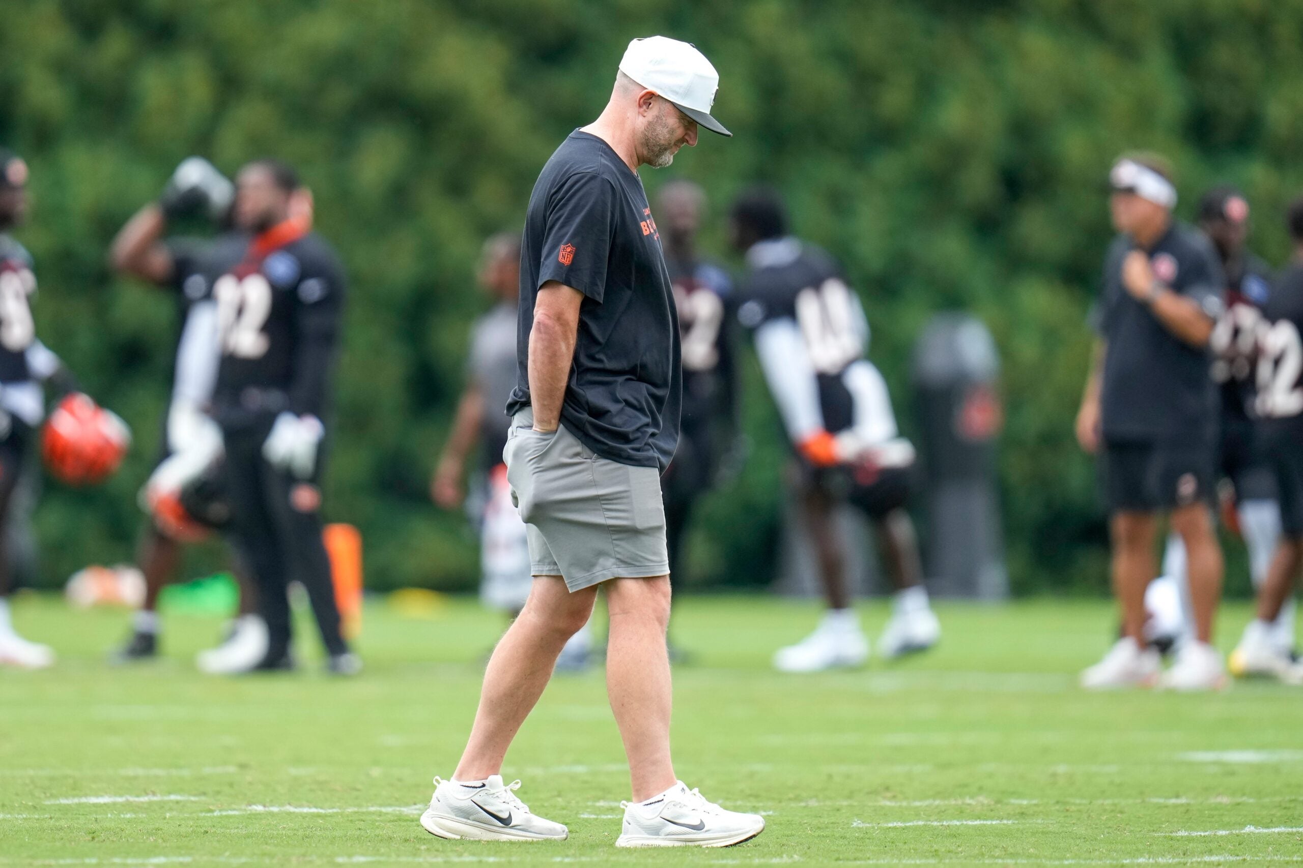 Director of player personnel Duke Tobin walks the field during practice at the Paycor Stadium practice field in downtown Cincinnati on Wednesday, Aug. 20, 2025.