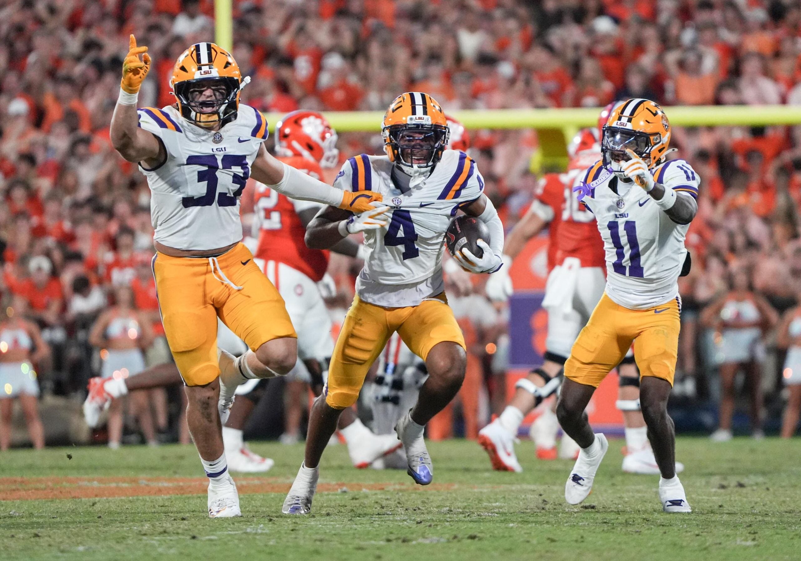 Louisiana State University linebacker West Weeks (33), cornerback Mansoor Delane (4) and cornerback PJ Woodland (11) react playing Clemson during the third quarter at Memorial Stadium in Clemson, S.C. Saturday, August 31, 2025.