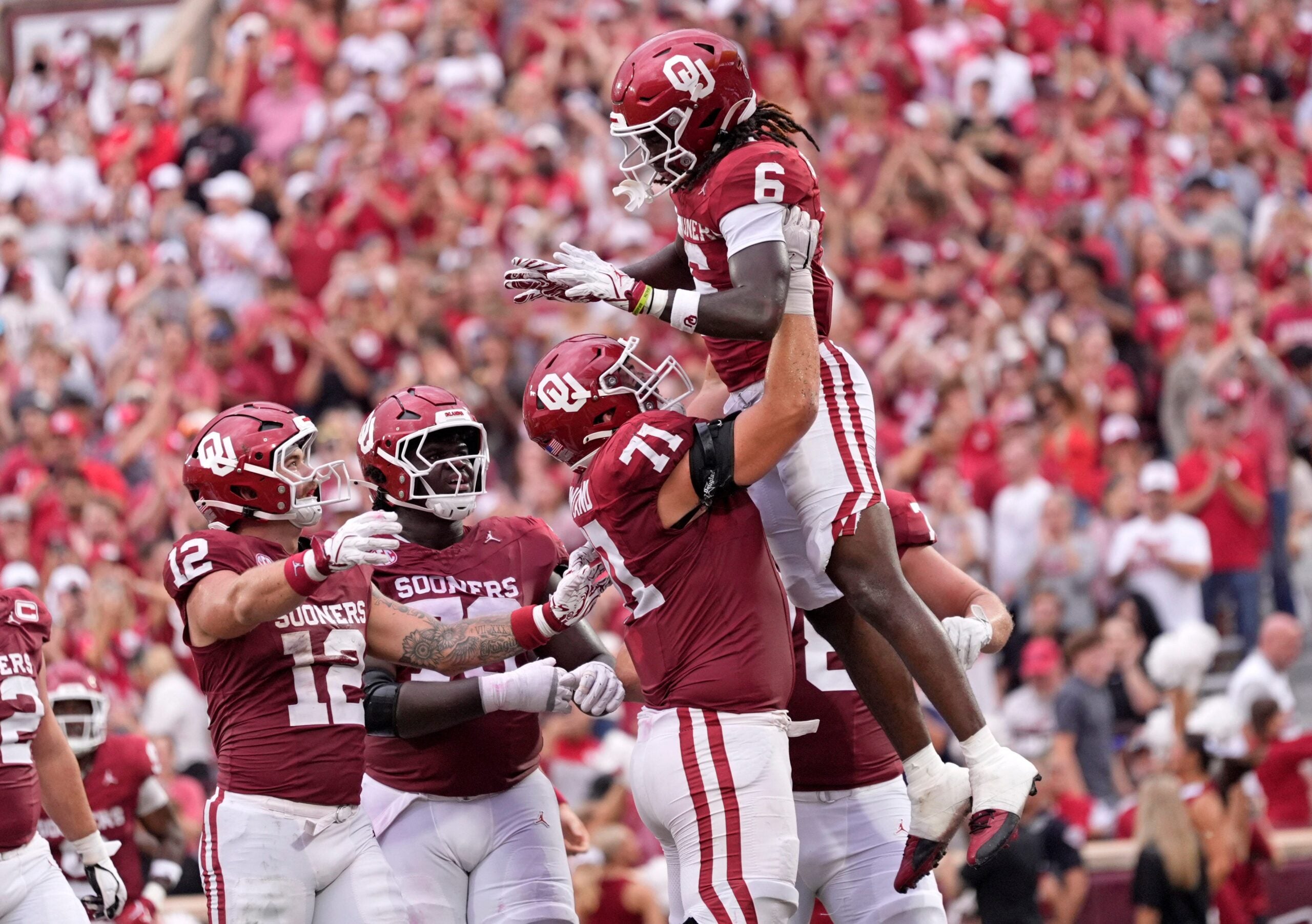 Oklahoma's Tory Blaylock (6) celebrates a touchdown with Logan Howland (71) in the first half of the college football game between the University of Oklahoma Sooners and the Illinois State Redbirds at the Gaylord Family Oklahoma Memorial Stadium in Norman, Okla., Saturday, Aug. 30, 2025.
