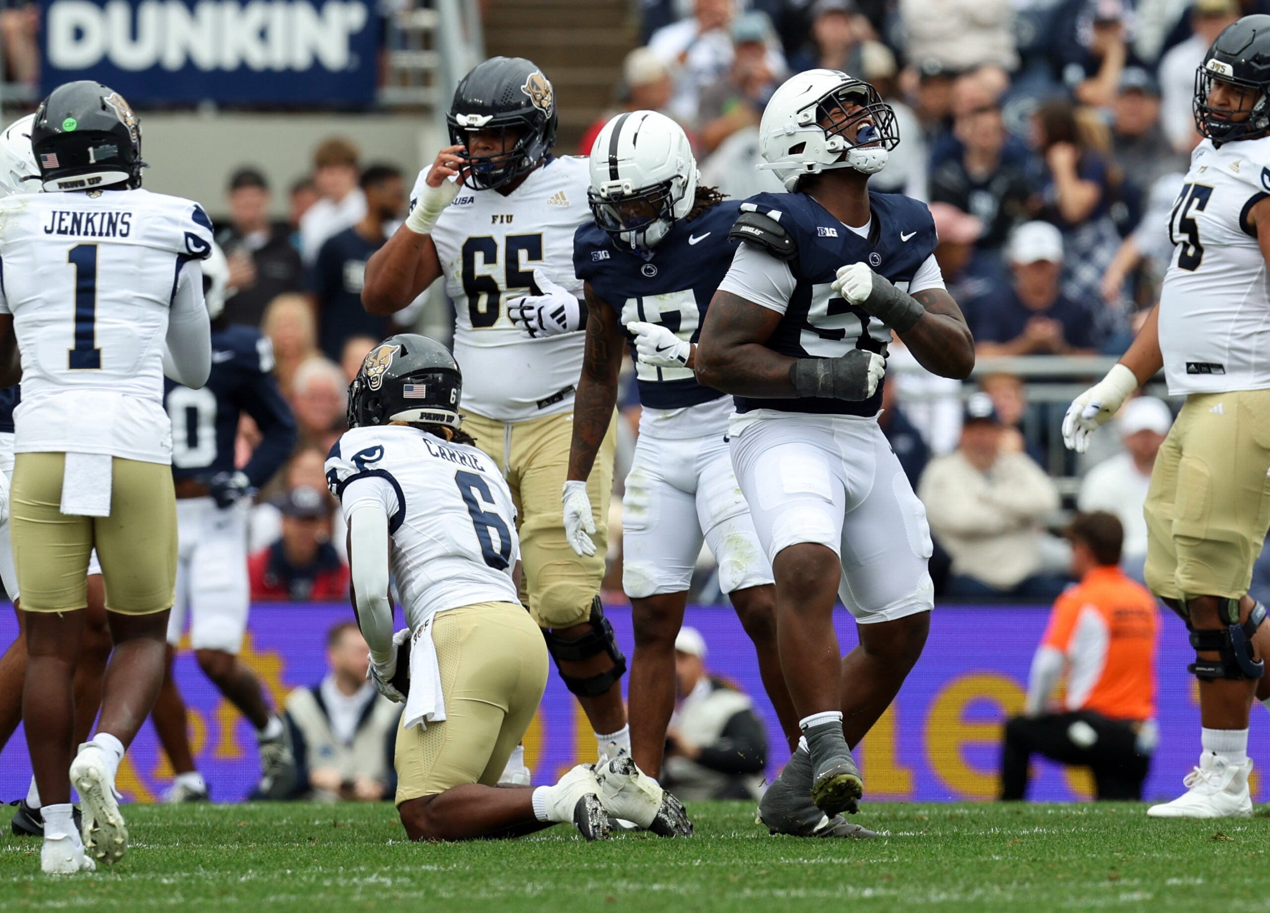 Sep 6, 2025; University Park, Pennsylvania, USA; Penn State Nittany Lions defensive tackle Xavier Gilliam (54) after tackling Florida International Panthers running back Anthony Carrie (6) for a loss of yards during the first quarter at Beaver Stadium. Mandatory Credit: Matthew O'Haren-Imagn Images