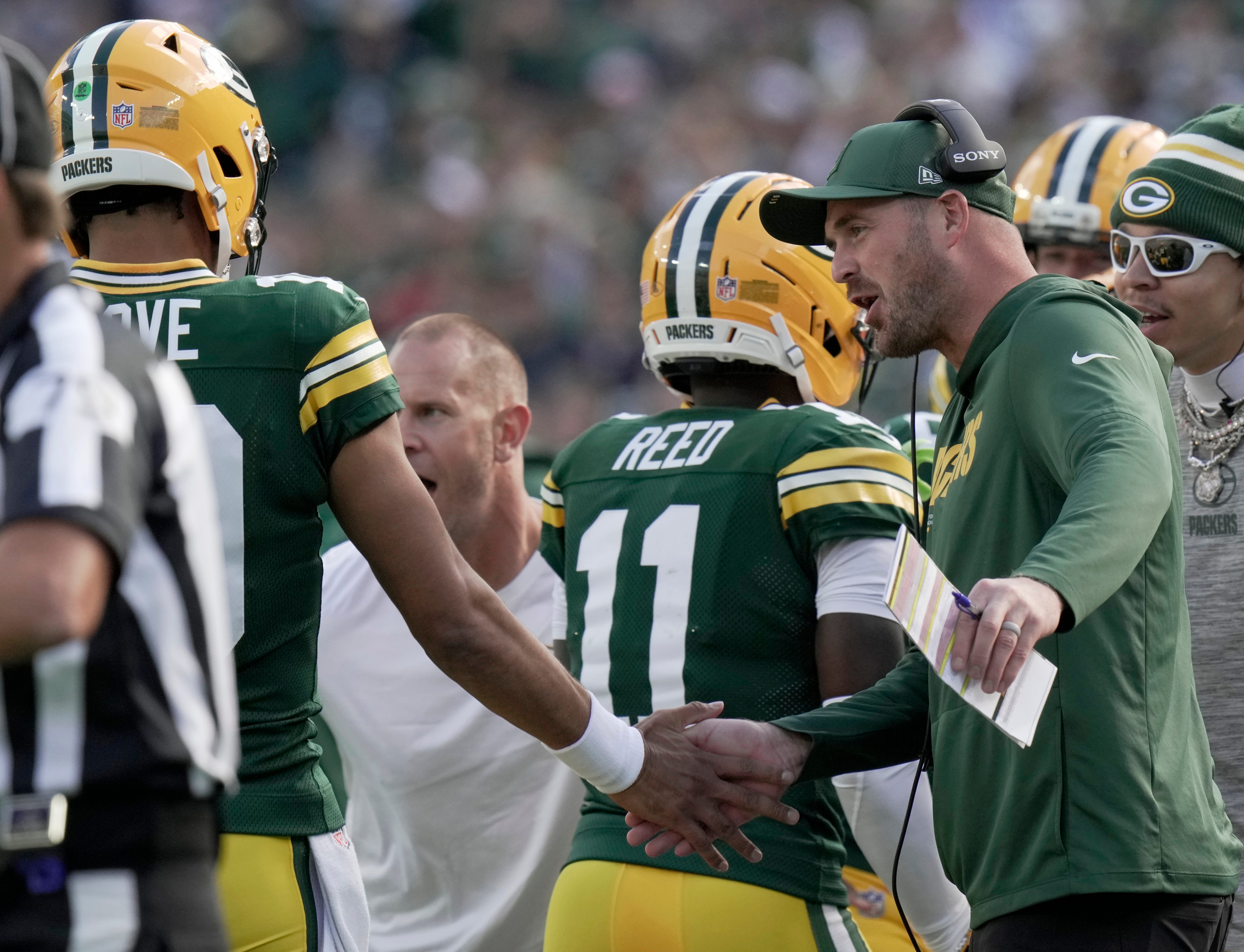 Green Bay Packers quarterback coach Sean Mannion is shown congratulating quarterback Jordan Love (10) during the second quarter of their game Sunday, September 7, 2025 at Lambeau Field in Green Bay, Wisconsin. The Green Bay Packers beat the Detroit Lions 27-13.