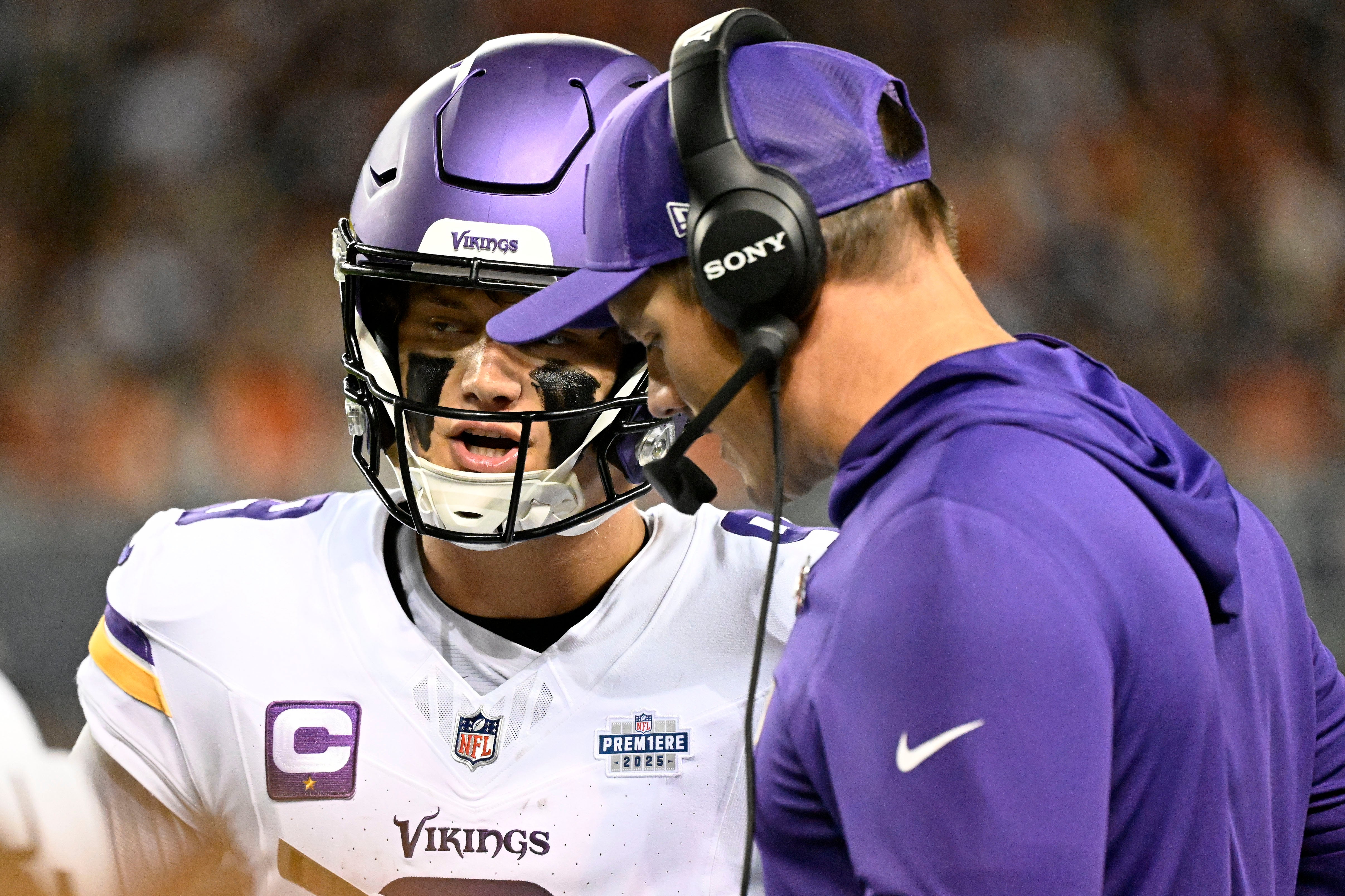 Sep 8, 2025; Chicago, Illinois, USA; Minnesota Vikings head coach Kevin O'Connell talks with quarterback J.J. McCarthy (9) during the first half at Soldier Field.